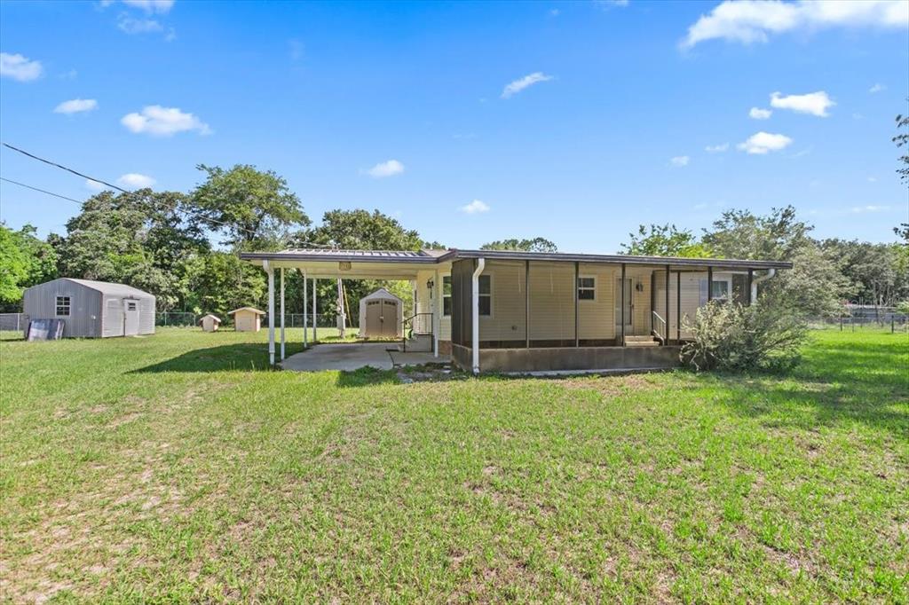 118 Frontier Drive Satsuma, FL 32189 - Photo 1 of 1 a view of a house with backyard and garden