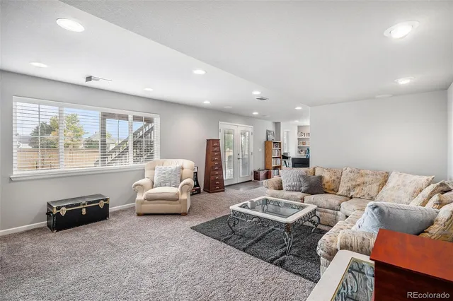 a living room with furniture or couch and a window