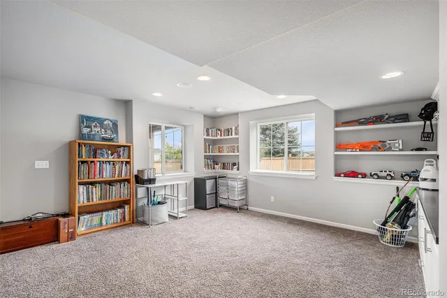 a view of room with window and workspace