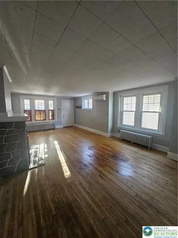 a view of livingroom with hardwood floor and window