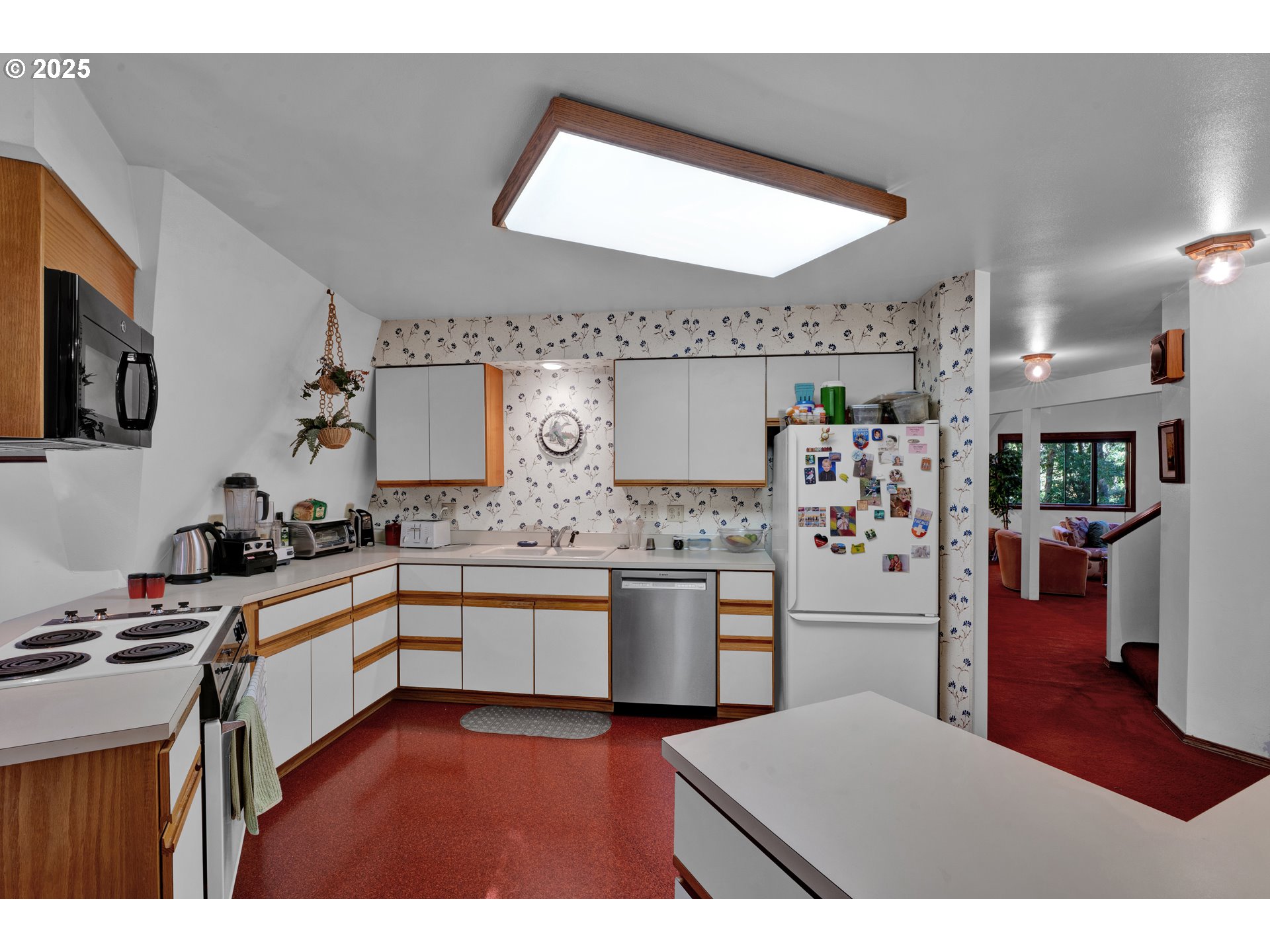 434 East 39th Avenue Eugene, OR 97405 - Photo 11 of 48 a kitchen with refrigerator and cabinets