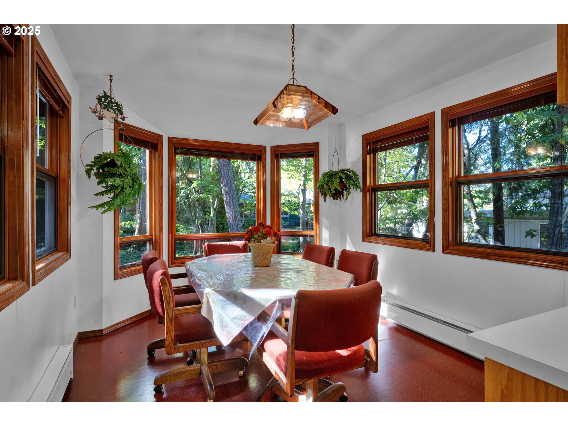 434 East 39th Avenue Eugene, OR 97405 - Photo 13 of 48 a view of a dining room with furniture large windows and wooden floor