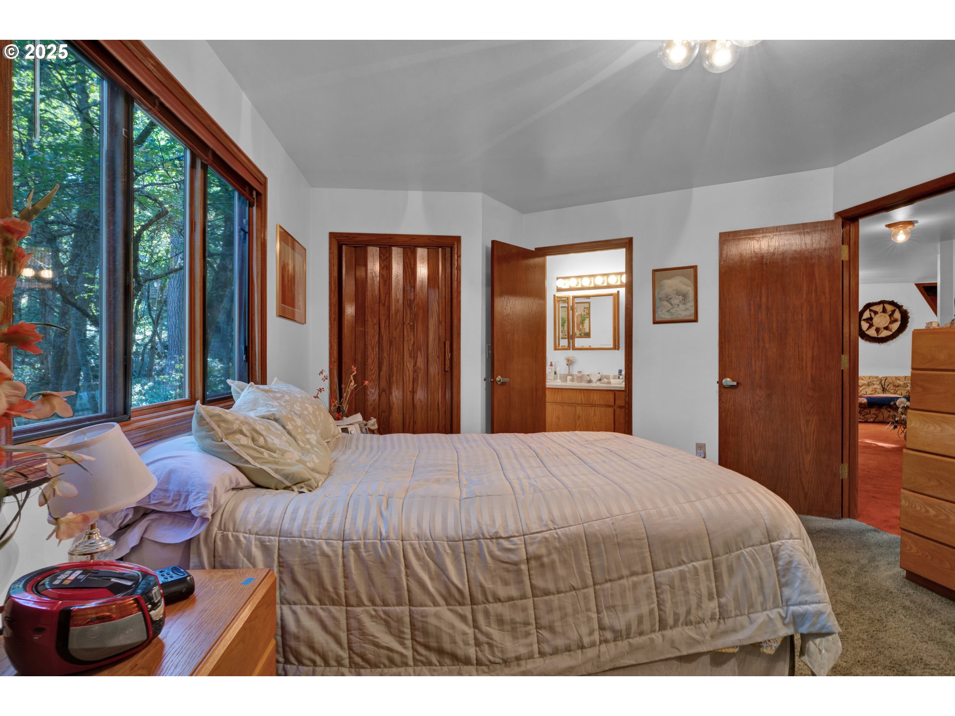 434 East 39th Avenue Eugene, OR 97405 - Photo 19 of 48 a bedroom with a bed next to a large window