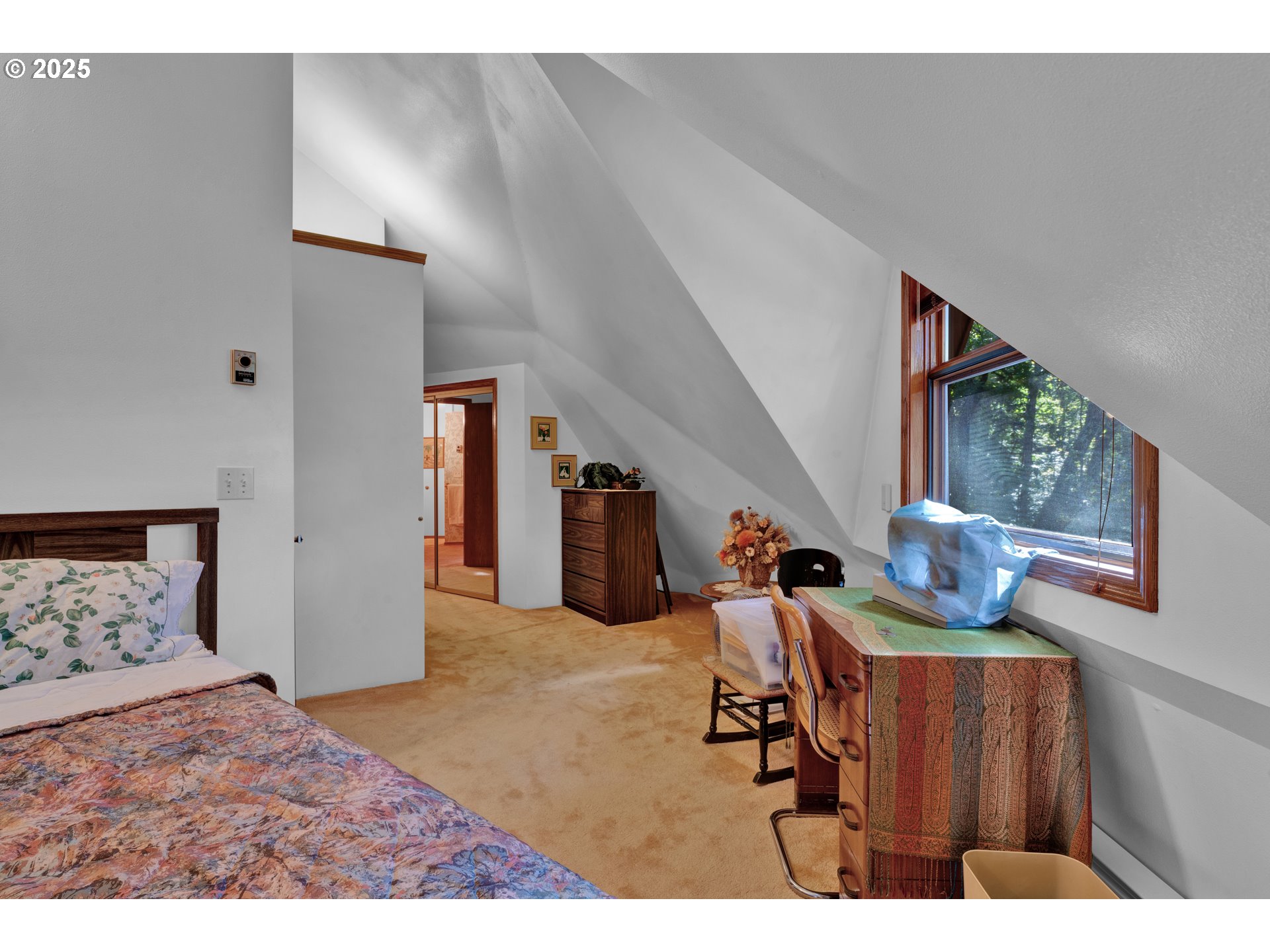 434 East 39th Avenue Eugene, OR 97405 - Photo 24 of 48 a bedroom with furniture and a lamp