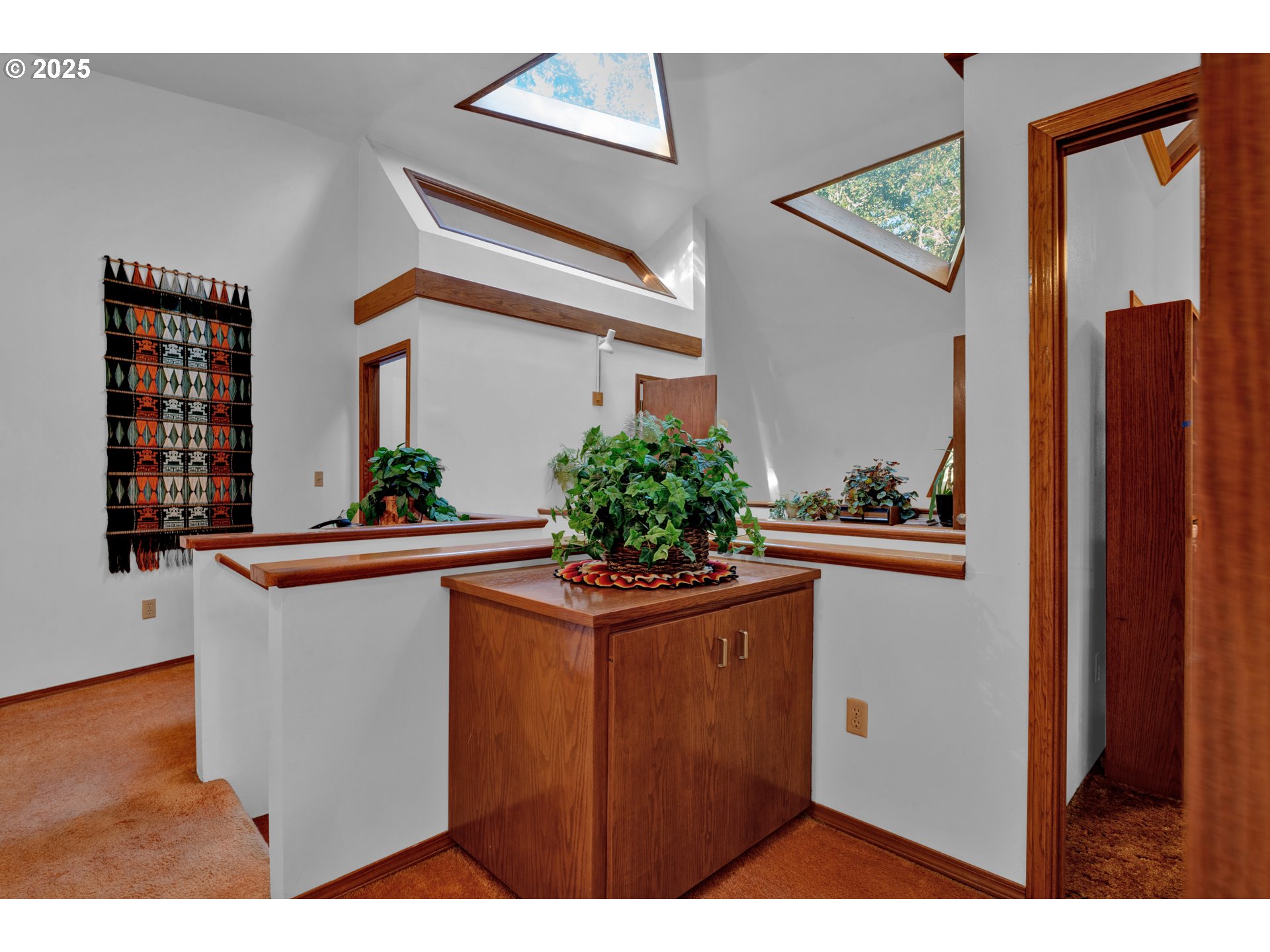 434 East 39th Avenue Eugene, OR 97405 - Photo 28 of 48 a room with kitchen island a potted plant a sink and a window