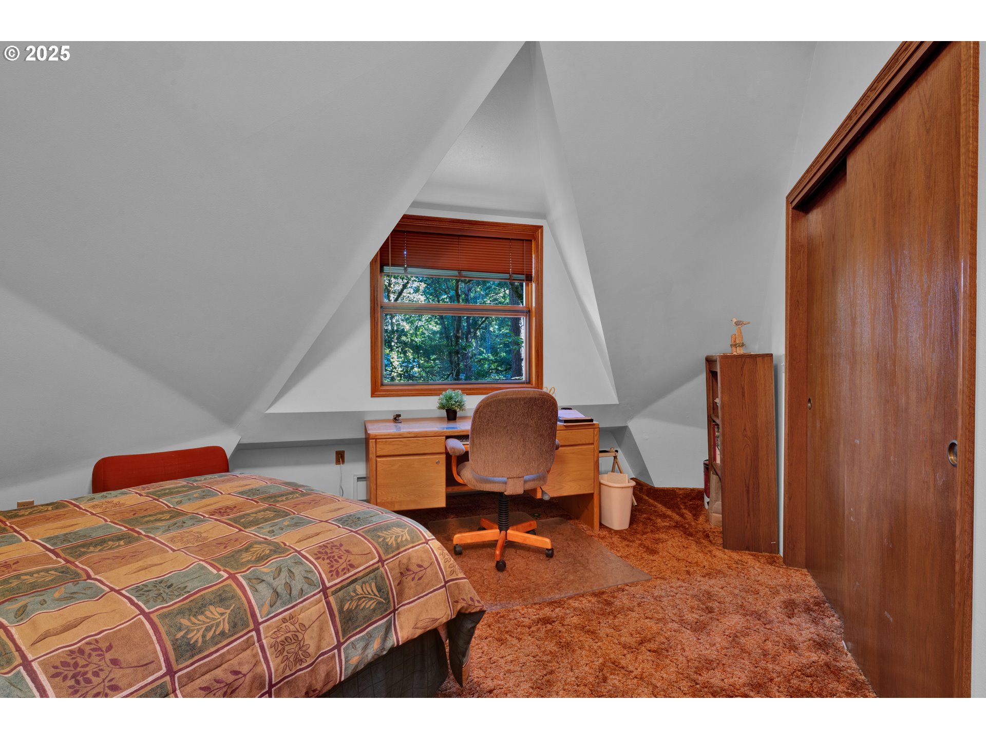 434 East 39th Avenue Eugene, OR 97405 - Photo 29 of 48 a bedroom with a bed and wooden floor