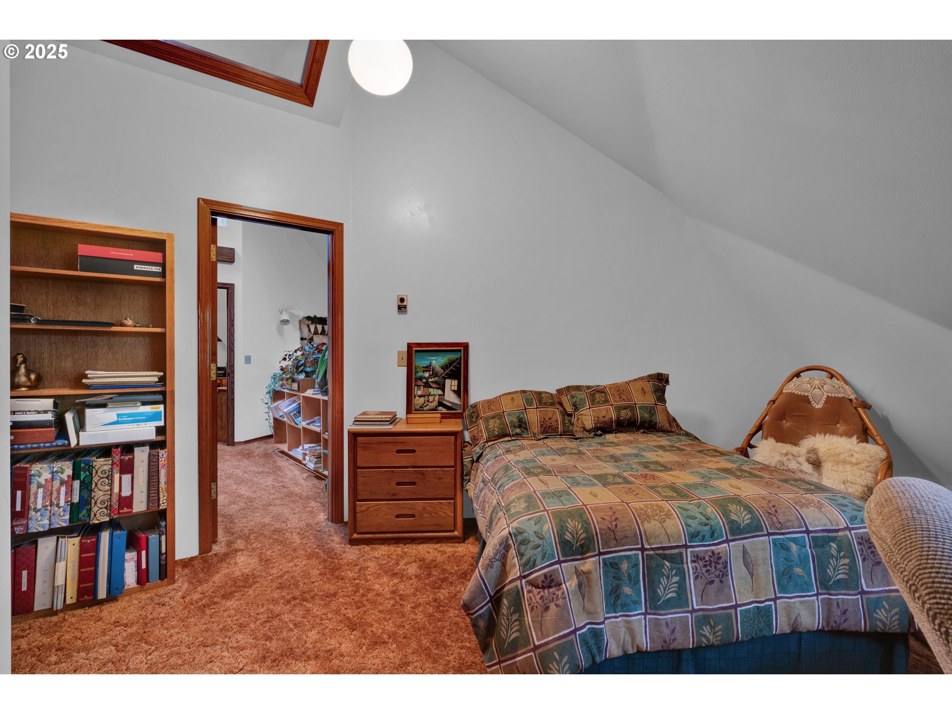 434 East 39th Avenue Eugene, OR 97405 - Photo 30 of 48 a bedroom with bed and a book shelf