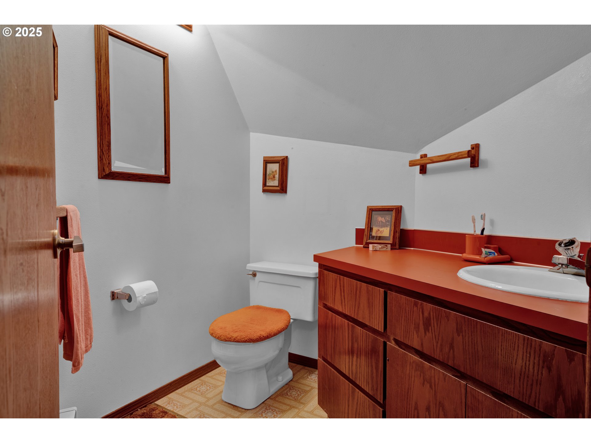 434 East 39th Avenue Eugene, OR 97405 - Photo 34 of 48 a bathroom with a granite countertop toilet sink and mirror