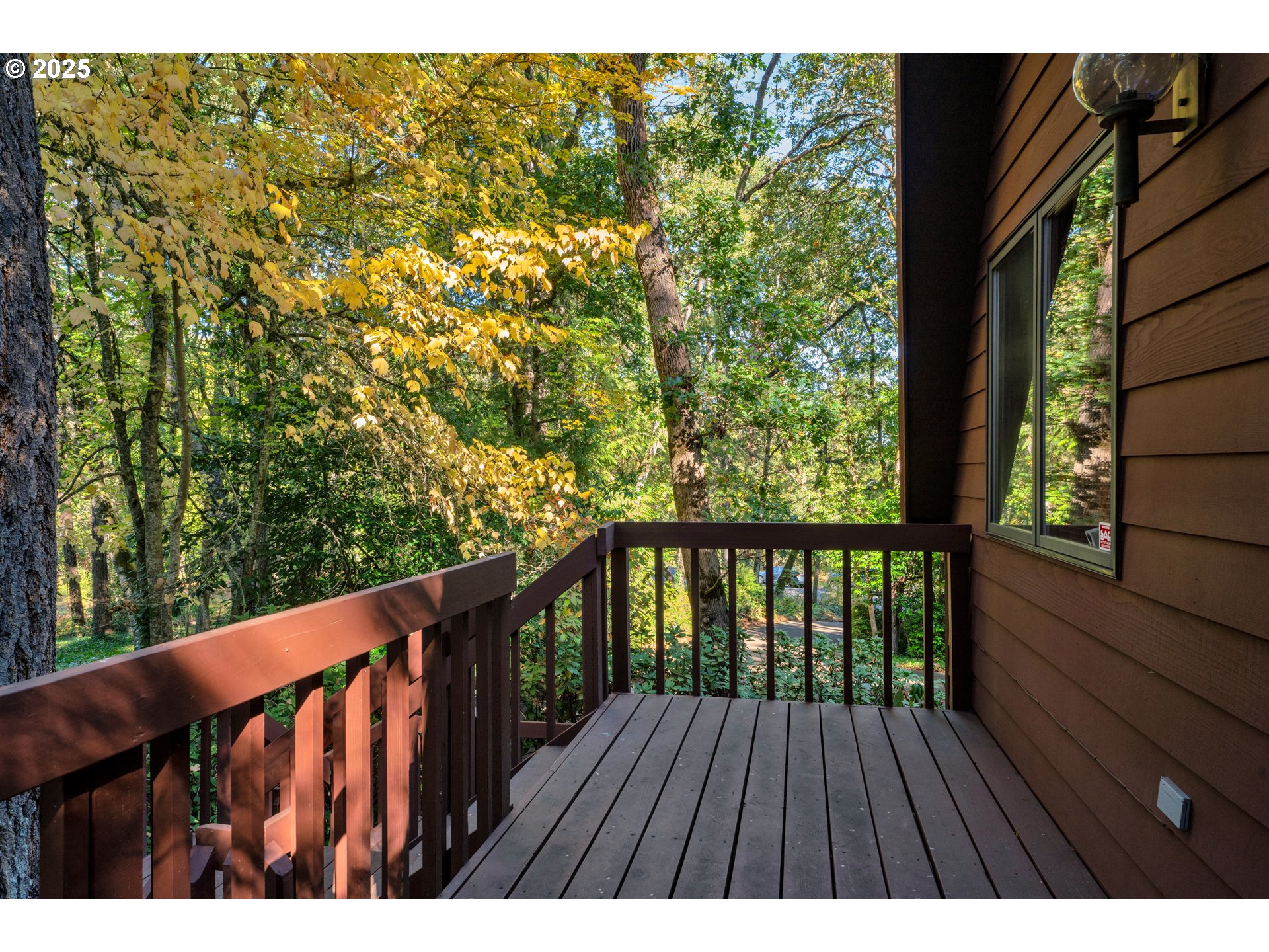 434 East 39th Avenue Eugene, OR 97405 - Photo 42 of 48 a balcony with wooden floor and fence