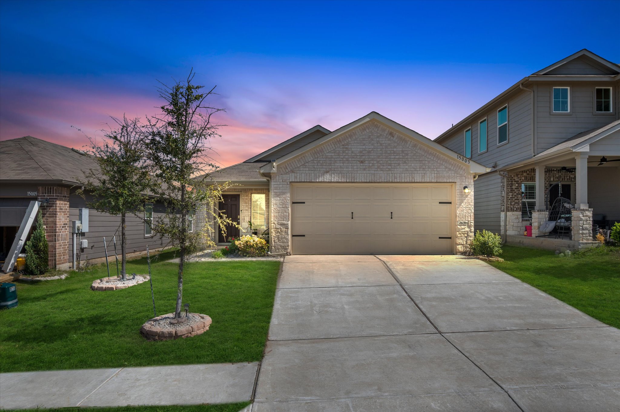 a front view of a house with garden
