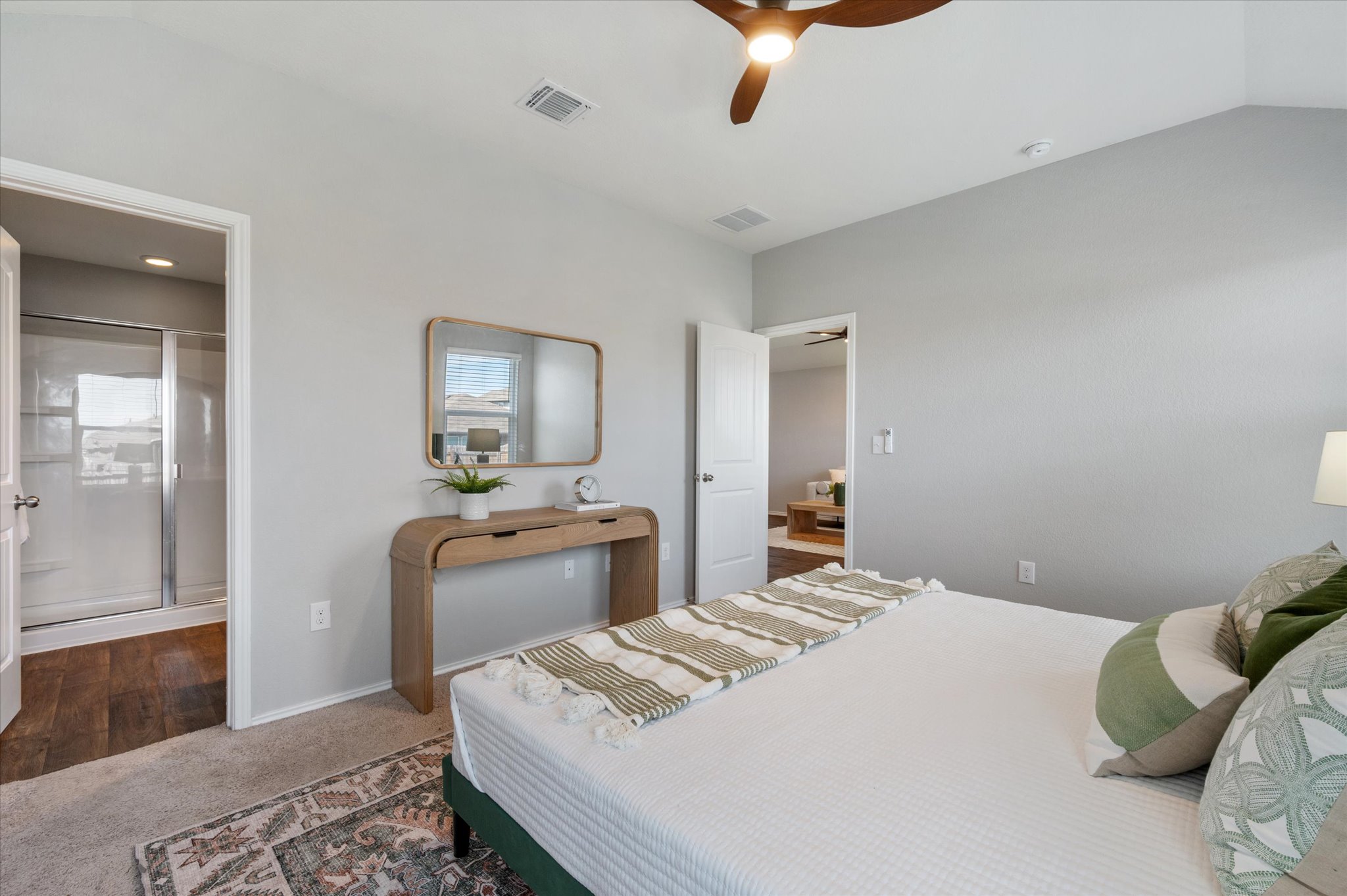 15003 Tuff Road Manor, TX 78653 - Photo 13 of 27 a bedroom with a bed and wooden floor