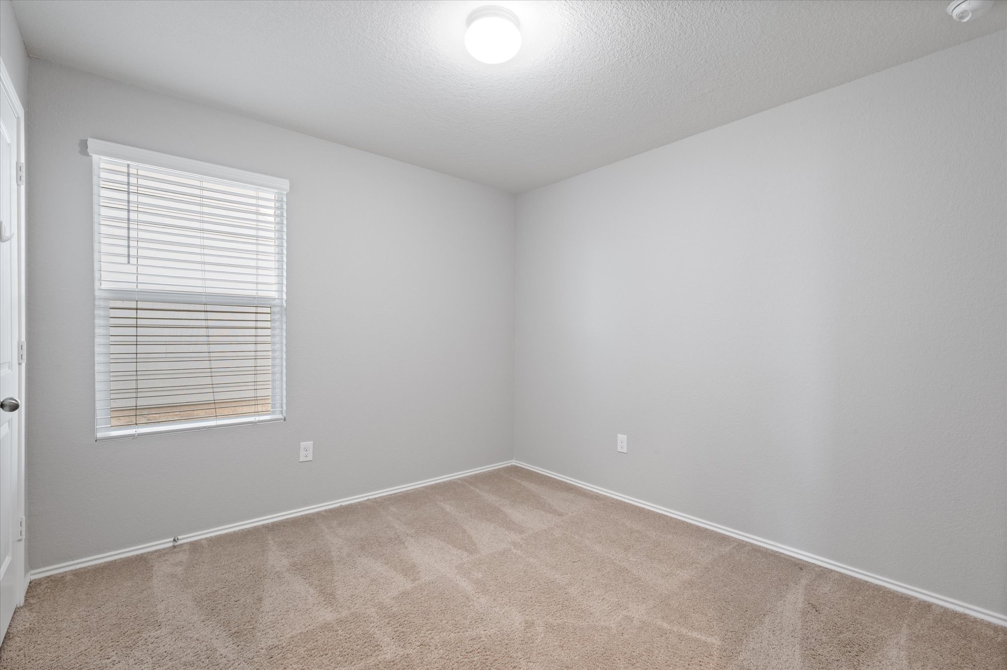 15003 Tuff Road Manor, TX 78653 - Photo 16 of 27 an empty room with a window