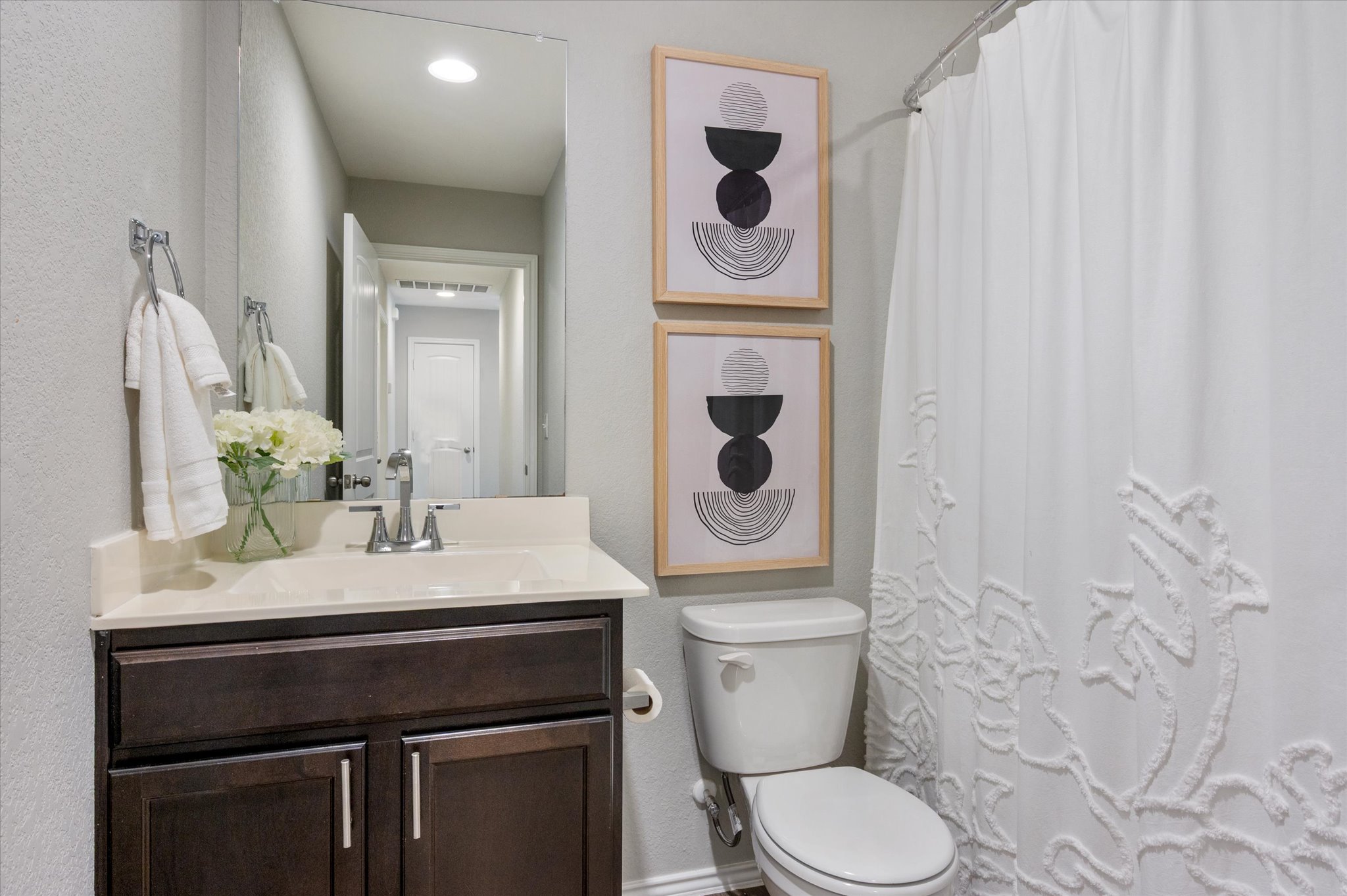 15003 Tuff Road Manor, TX 78653 - Photo 19 of 27 a bathroom with a toilet a sink and mirror