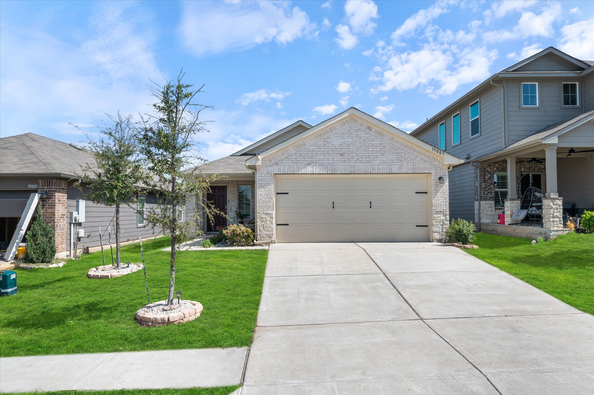 15003 Tuff Road Manor, TX 78653 - Photo 2 of 27 a view of a house with backyard and a tree