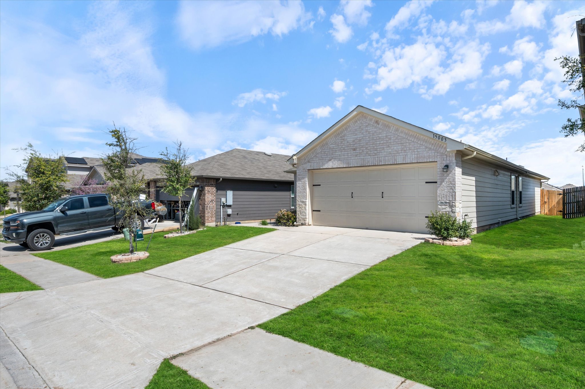 15003 Tuff Road Manor, TX 78653 - Photo 26 of 27 a front view of house with yard and green space
