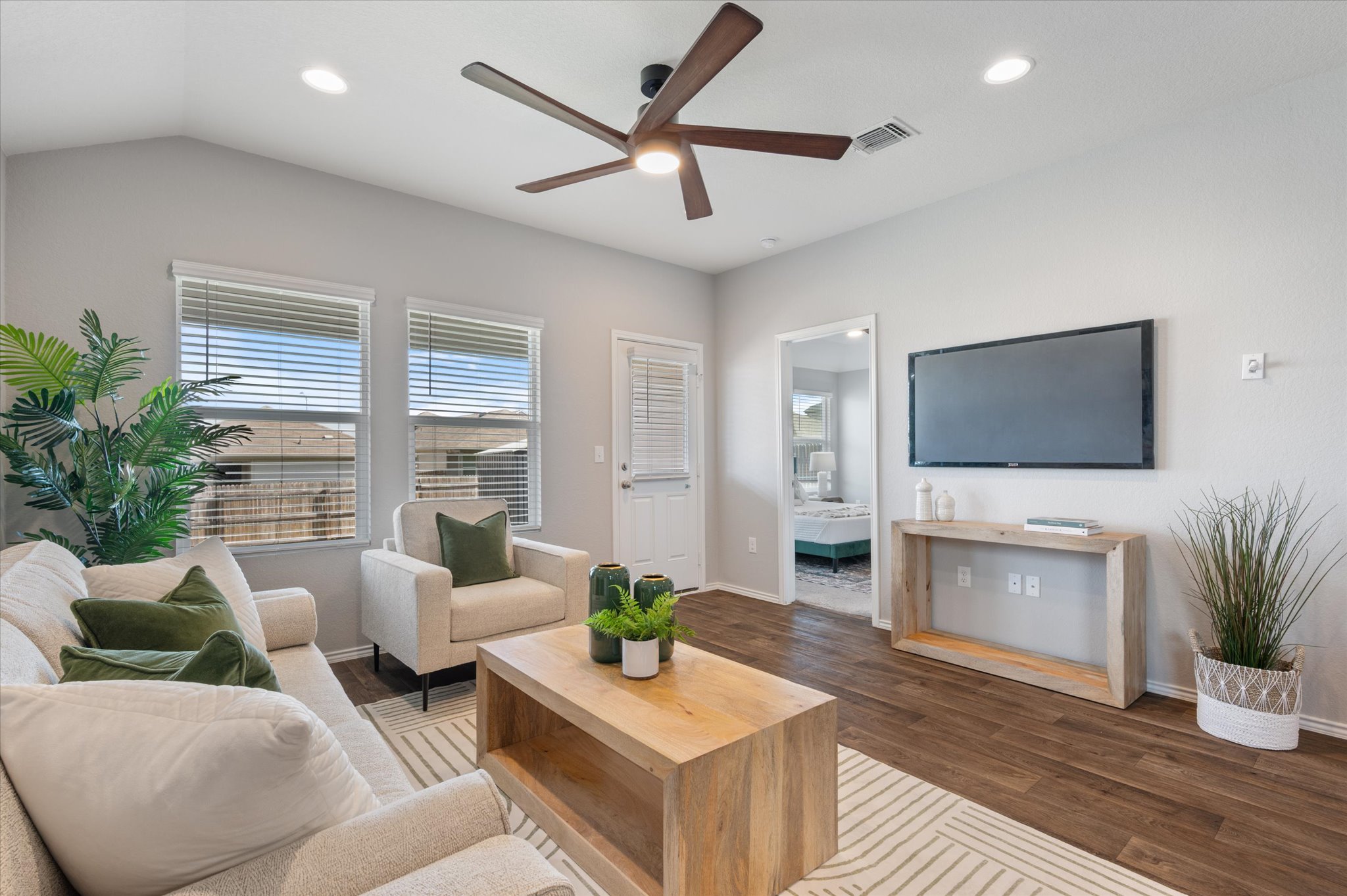 15003 Tuff Road Manor, TX 78653 - Photo 5 of 27 a living room with furniture and a flat screen tv