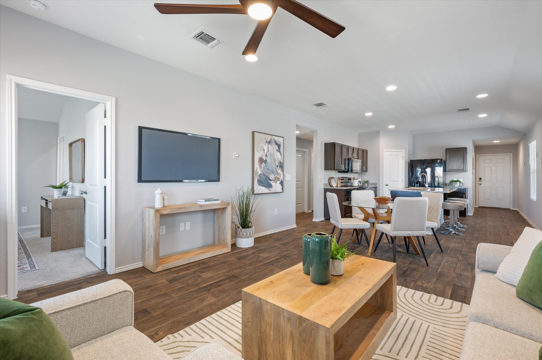 15003 Tuff Road Manor, TX 78653 - Photo 6 of 27 a living room with furniture and a flat screen tv