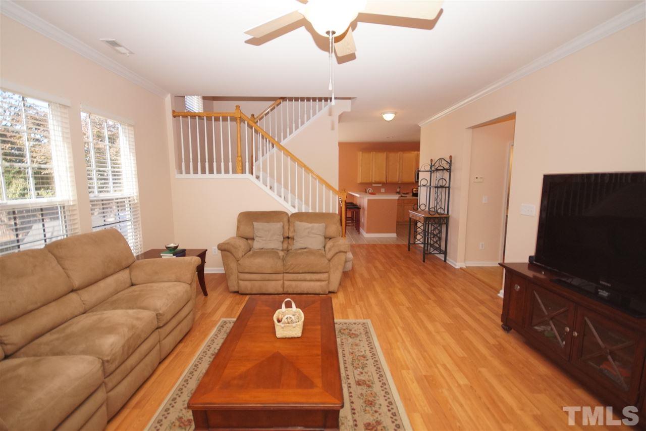 7449 Lagrange Drive Raleigh, NC 27613 - Photo 11 of 24 a living room with furniture and a flat screen tv