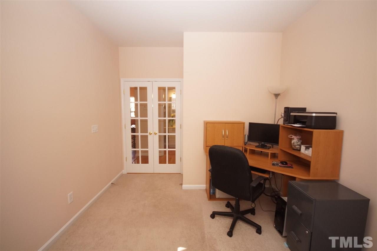 7449 Lagrange Drive Raleigh, NC 27613 - Photo 12 of 24 a view of a workspace with furniture and a window