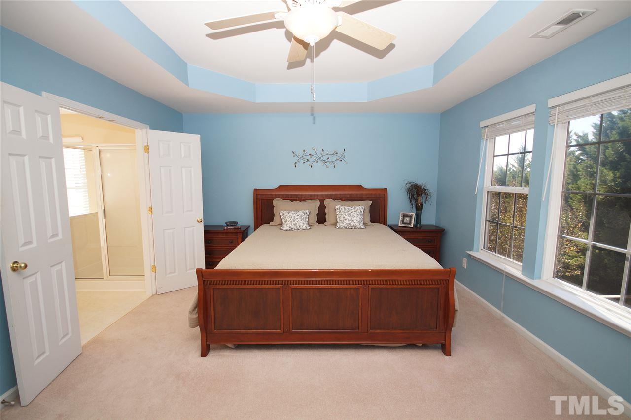 7449 Lagrange Drive Raleigh, NC 27613 - Photo 13 of 24 a bedroom with a bed and window