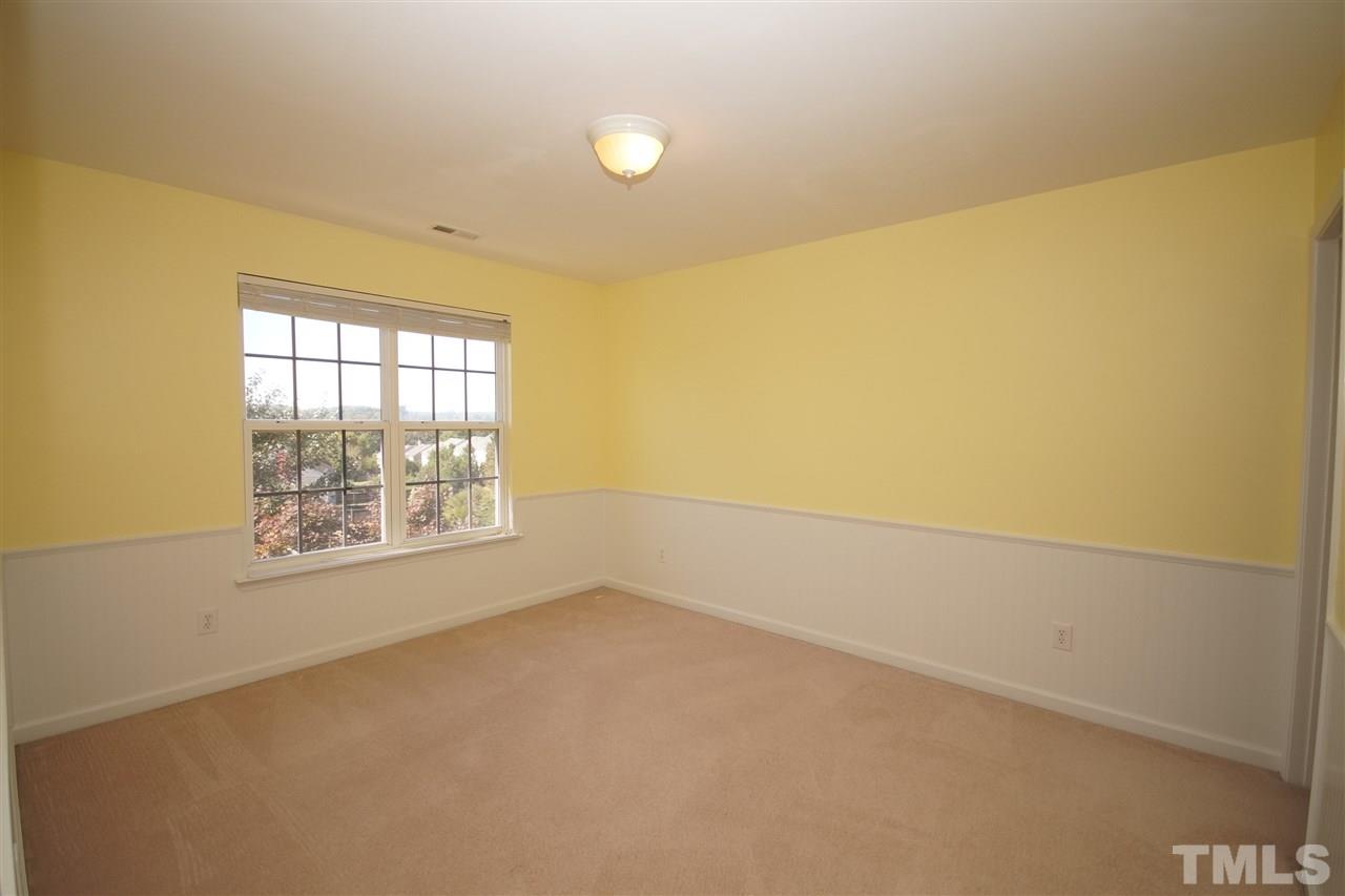 7449 Lagrange Drive Raleigh, NC 27613 - Photo 16 of 24 an empty room with windows