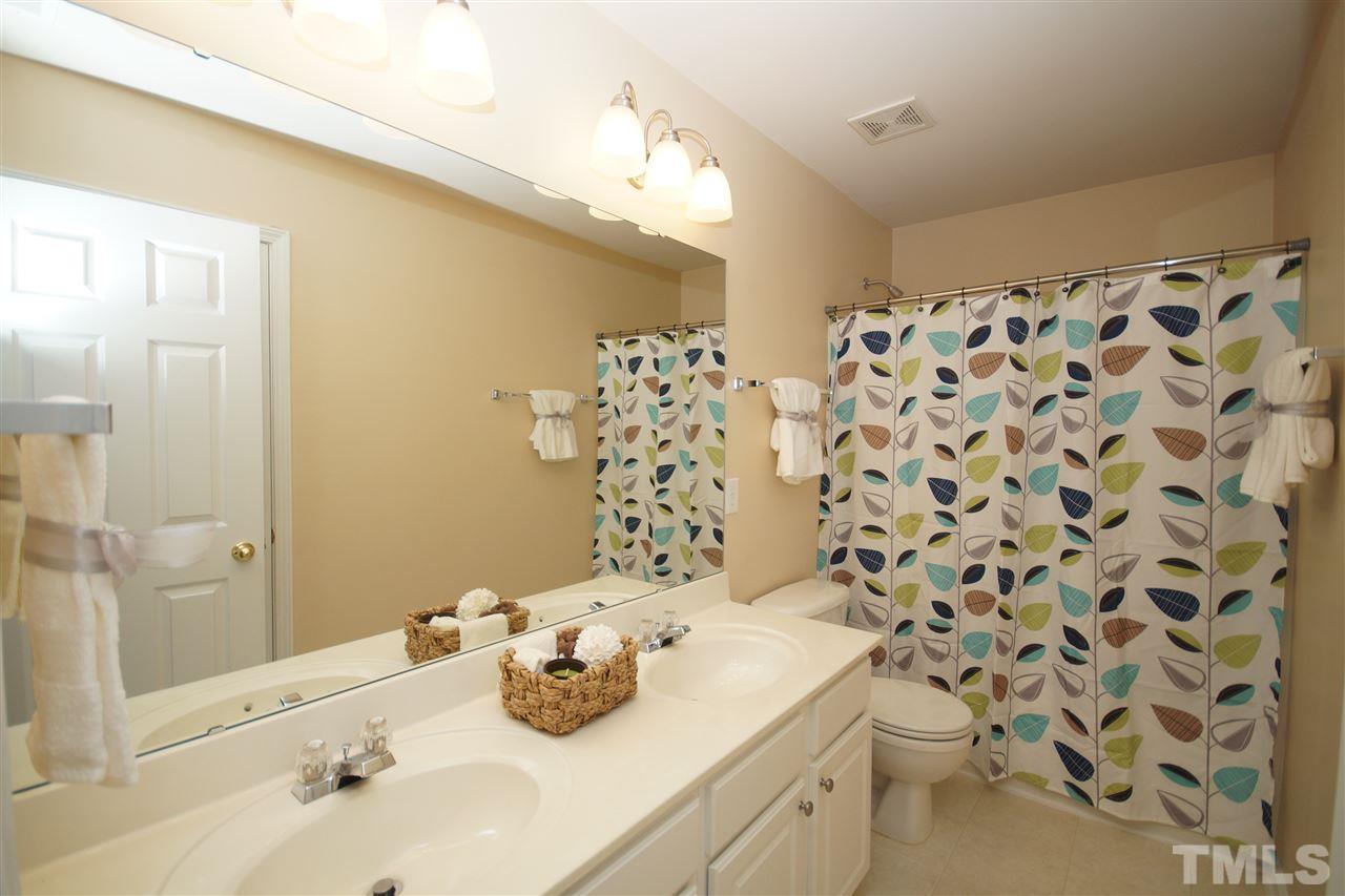 7449 Lagrange Drive Raleigh, NC 27613 - Photo 17 of 24 a bathroom with a sink toilet and shower