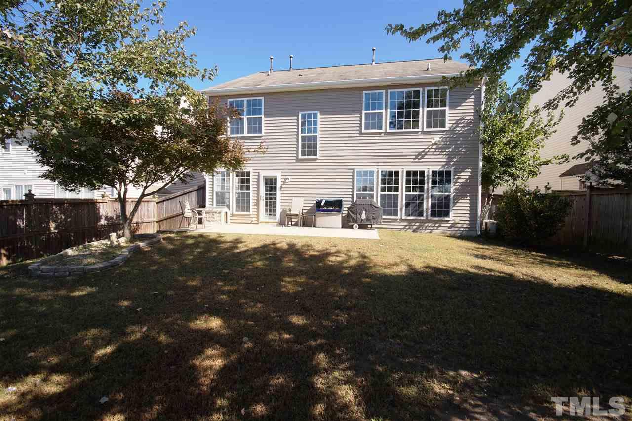 7449 Lagrange Drive Raleigh, NC 27613 - Photo 22 of 24 a front view of a house with a yard