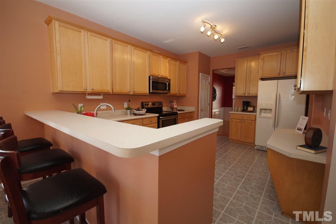 7449 Lagrange Drive Raleigh, NC 27613 - Photo 7 of 24 a kitchen with a sink cabinets and appliances