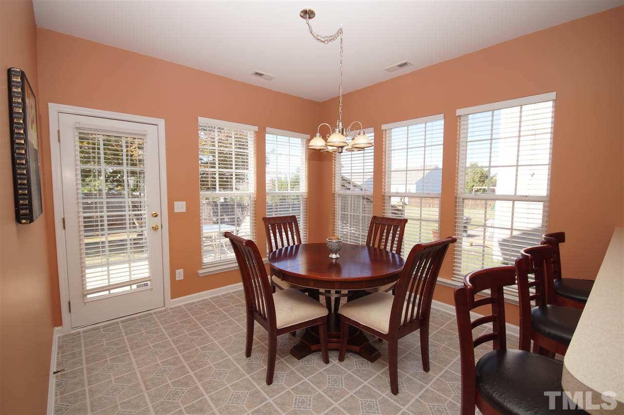 7449 Lagrange Drive Raleigh, NC 27613 - Photo 8 of 24 a view of a dining room with furniture window and outside view