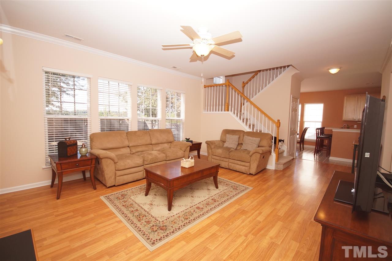 7449 Lagrange Drive Raleigh, NC 27613 - Photo 10 of 24 a living room with furniture and a wooden floor