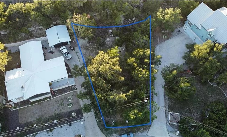 618 Galston Spicewood, TX 78669 - Photo 13 of 14 an aerial view of a house with a yard and large trees