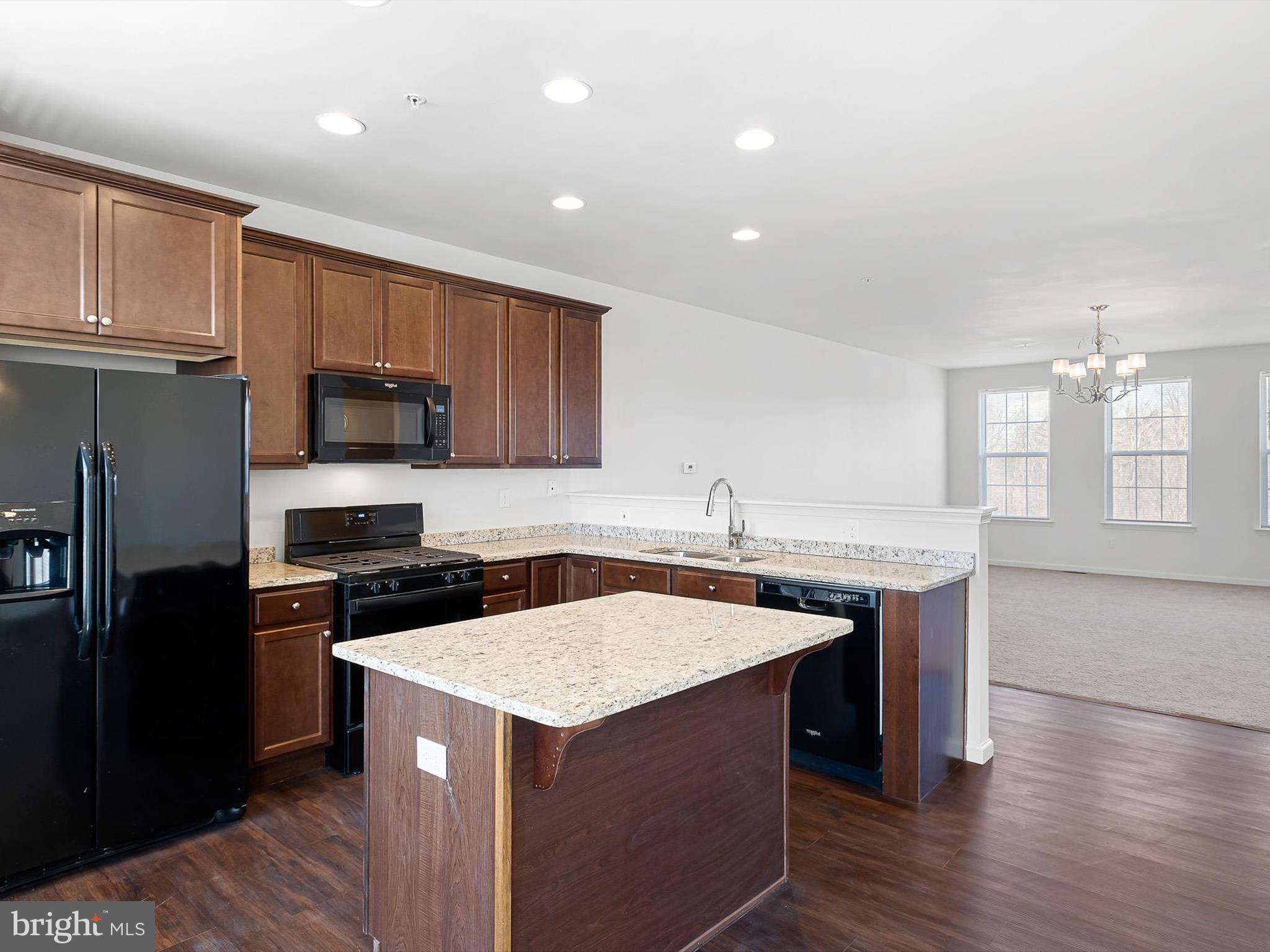 415 Lenape Way Claymont, DE 19703 - Photo 11 of 26 a kitchen with a sink stove and refrigerator