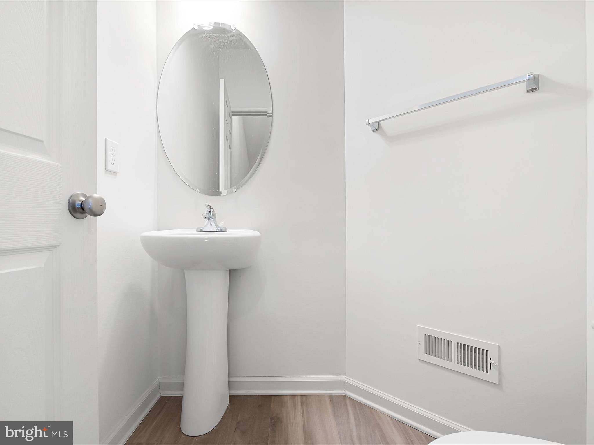 415 Lenape Way Claymont, DE 19703 - Photo 12 of 26 a bathroom with a sink a mirror and shower