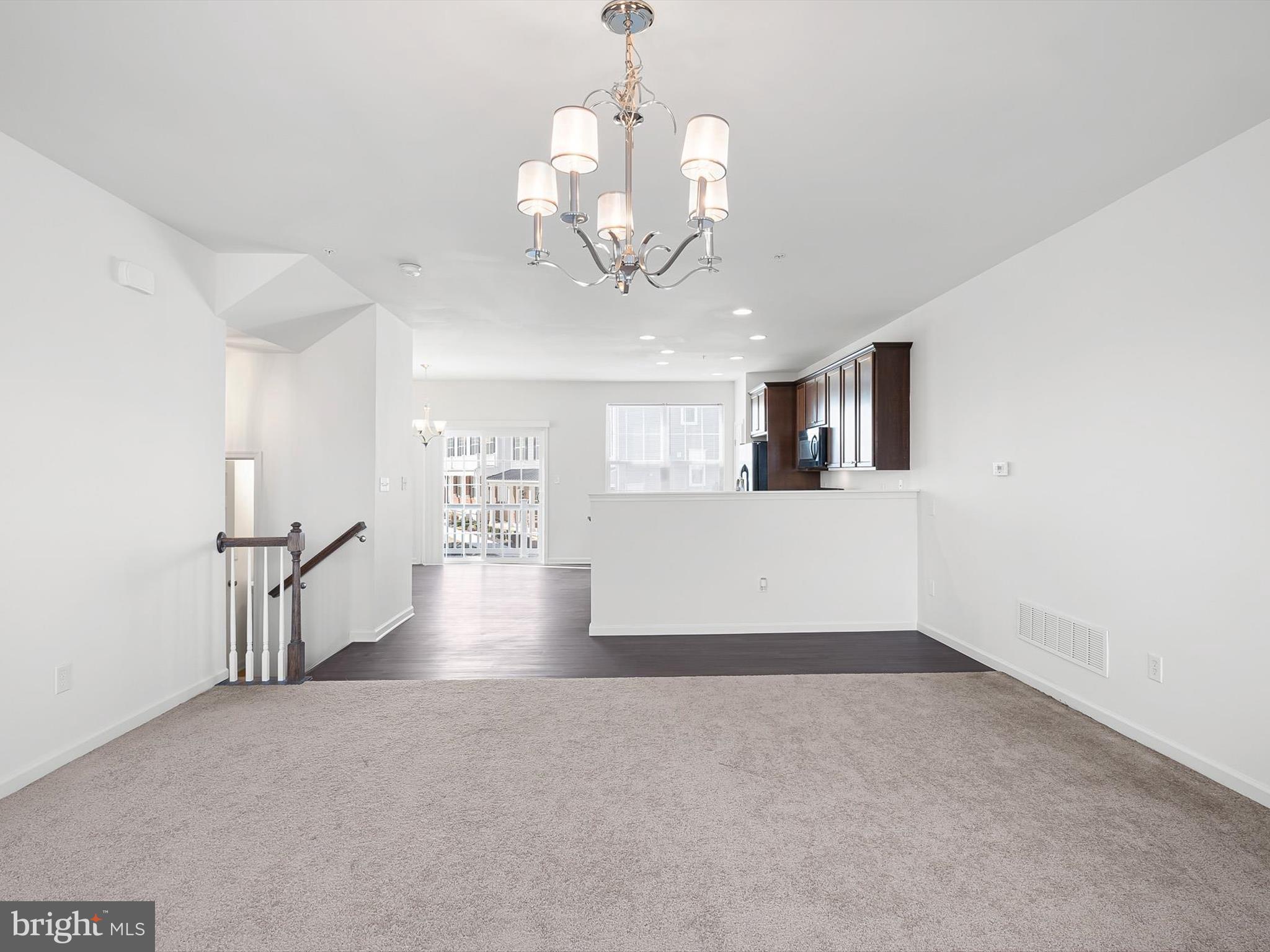 415 Lenape Way Claymont, DE 19703 - Photo 13 of 26 wooden floor in an empty room with a window