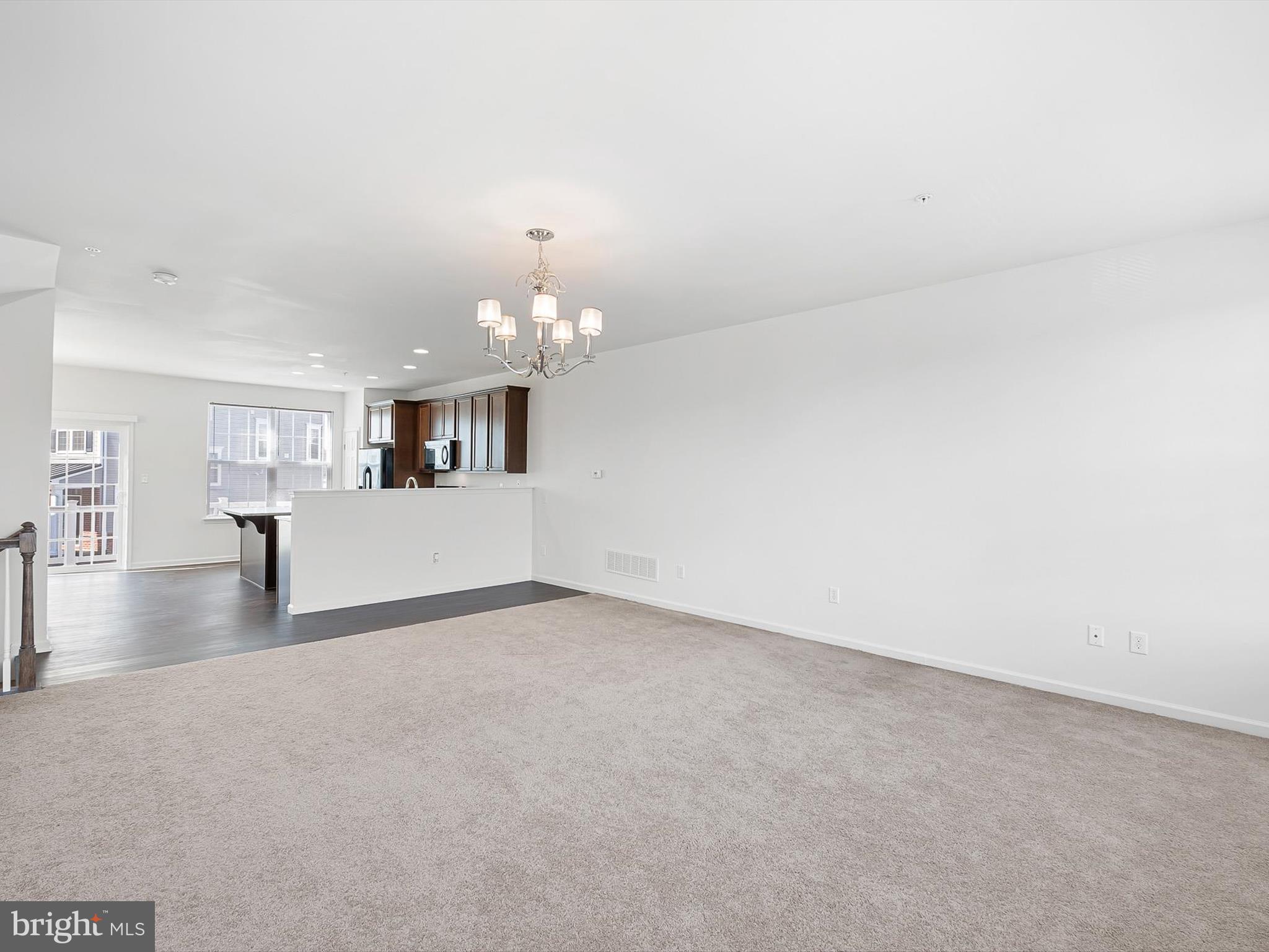 415 Lenape Way Claymont, DE 19703 - Photo 14 of 26 a view of a livingroom and a kitchen with sink