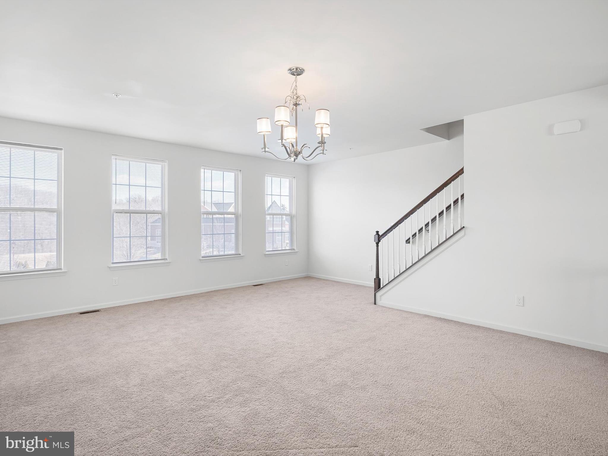 415 Lenape Way Claymont, DE 19703 - Photo 16 of 26 an empty room with chandelier fan