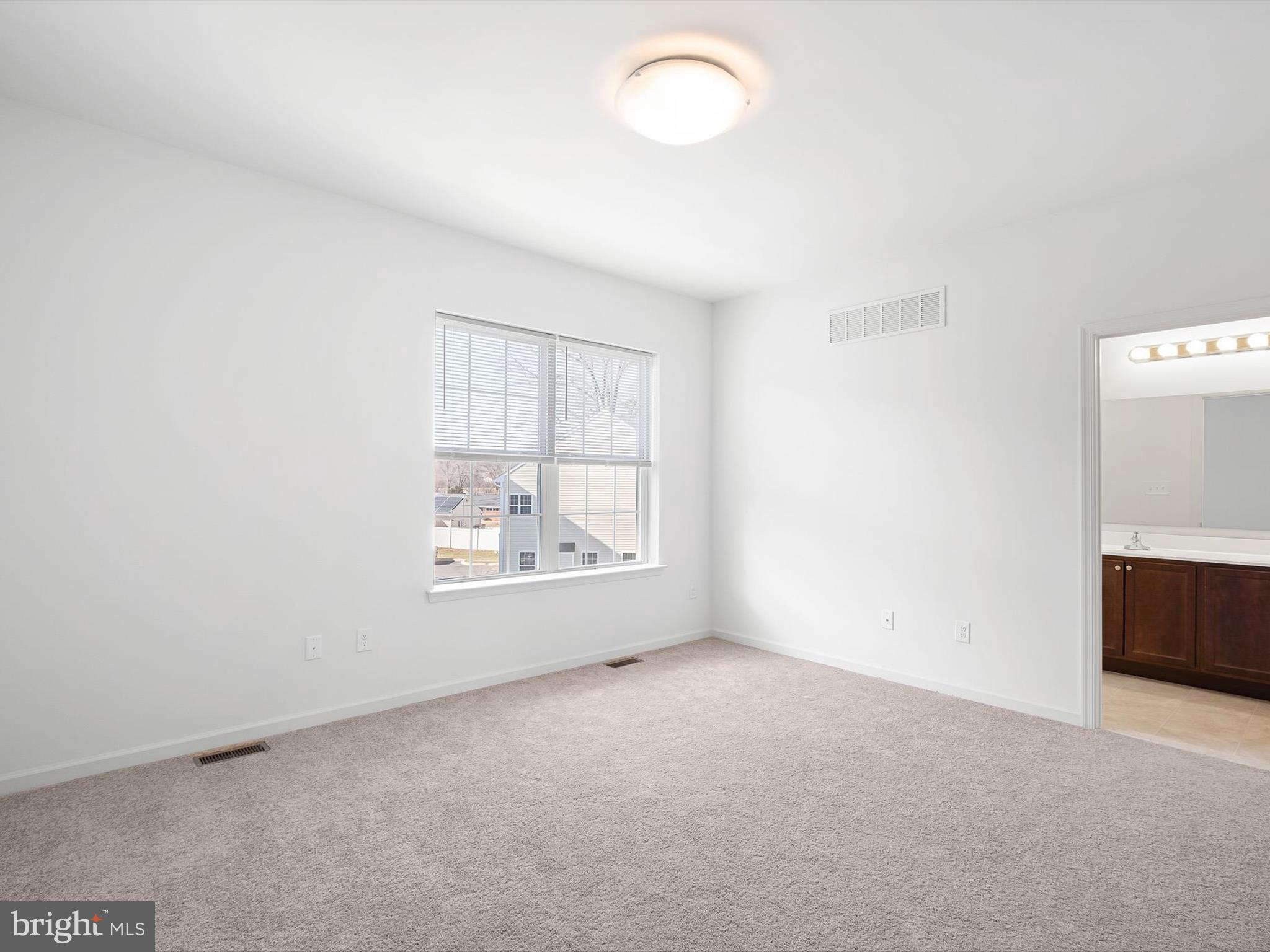 415 Lenape Way Claymont, DE 19703 - Photo 18 of 26 an empty room with windows