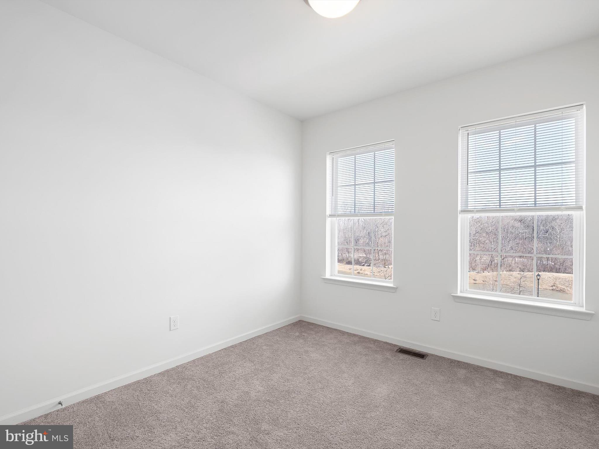 415 Lenape Way Claymont, DE 19703 - Photo 21 of 26 an empty room with windows