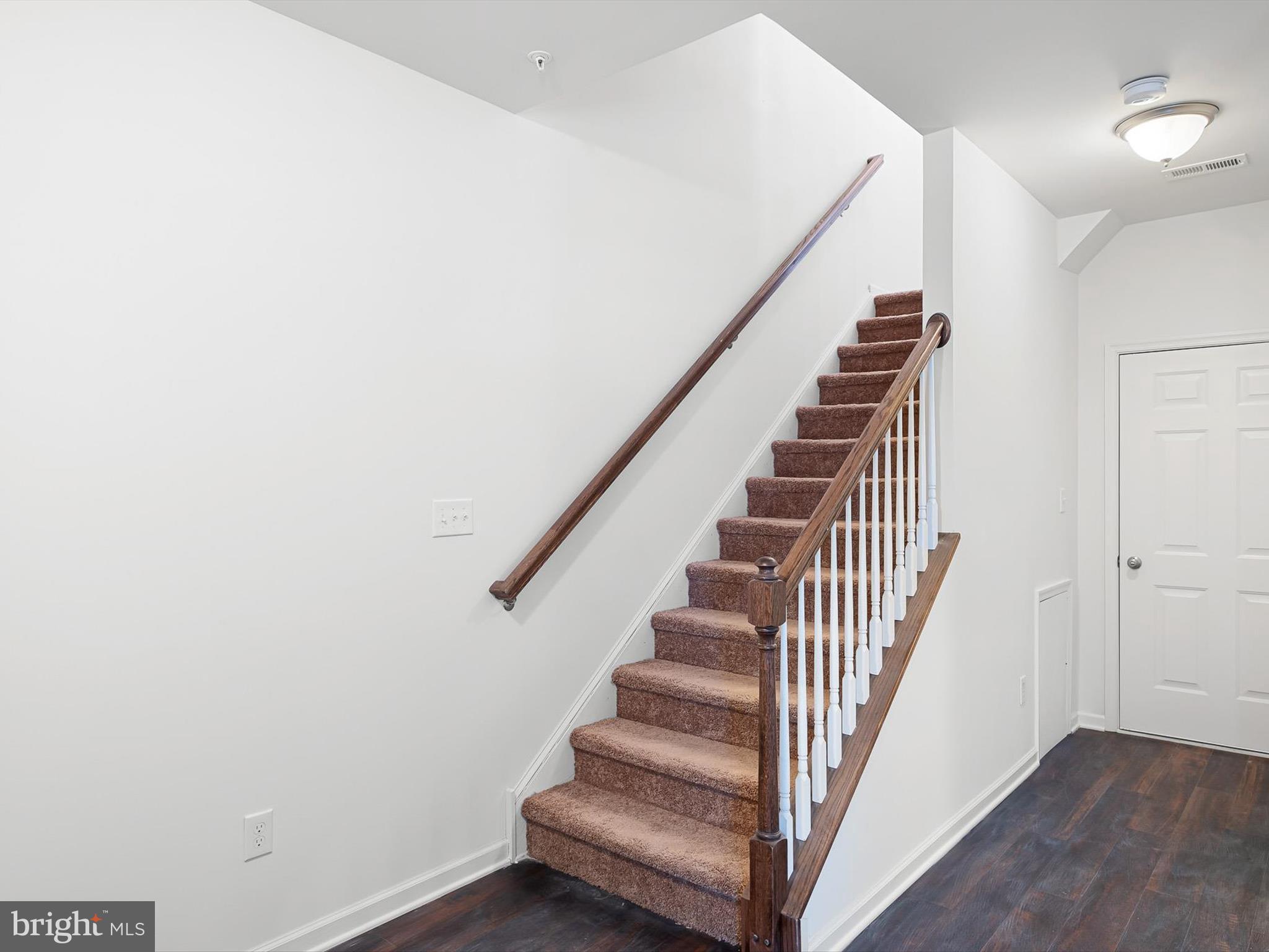 415 Lenape Way Claymont, DE 19703 - Photo 6 of 26 a view of entryway with wooden floor