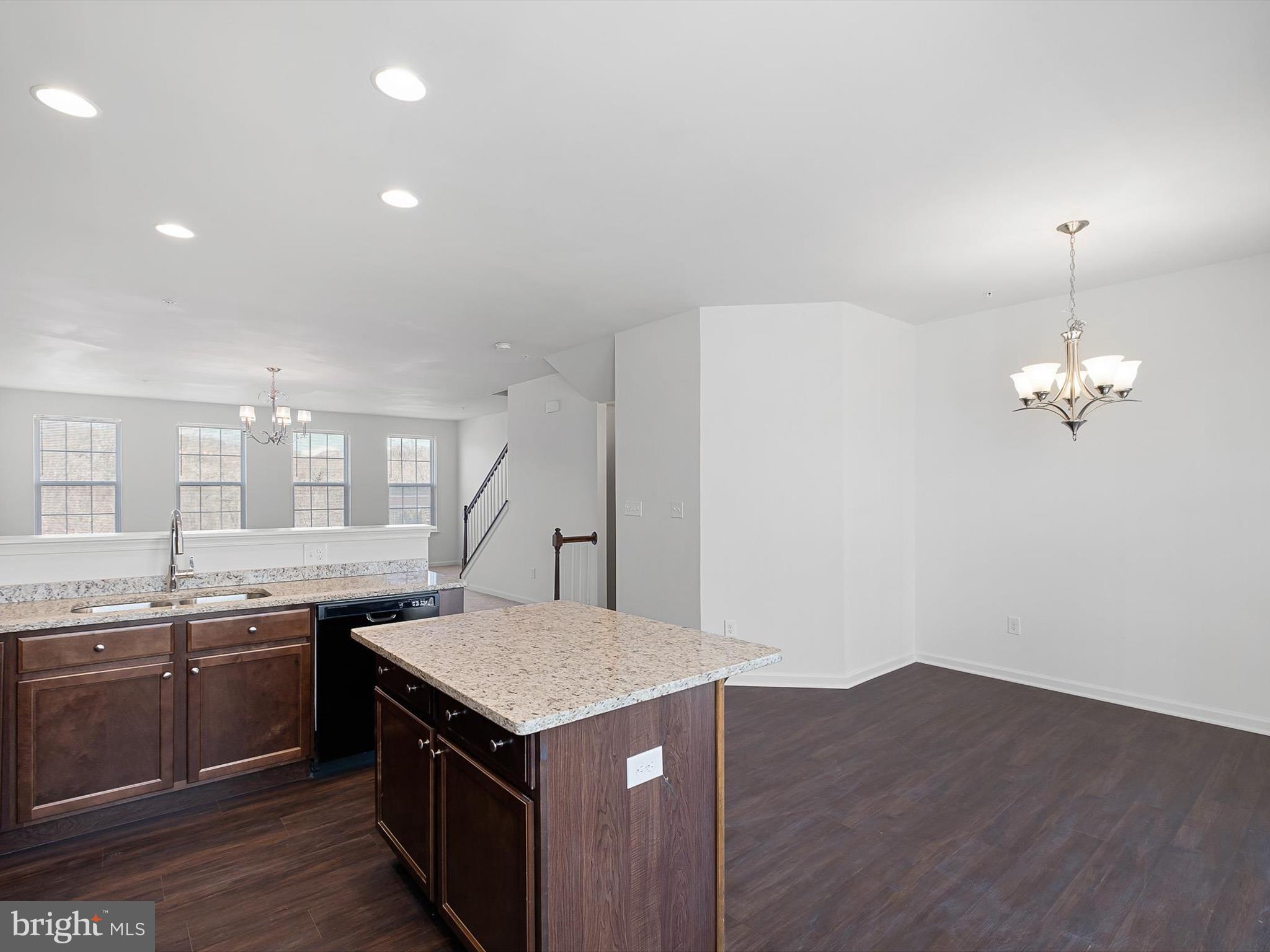 415 Lenape Way Claymont, DE 19703 - Photo 7 of 26 a kitchen that has a lot of cabinets in it and wooden floor