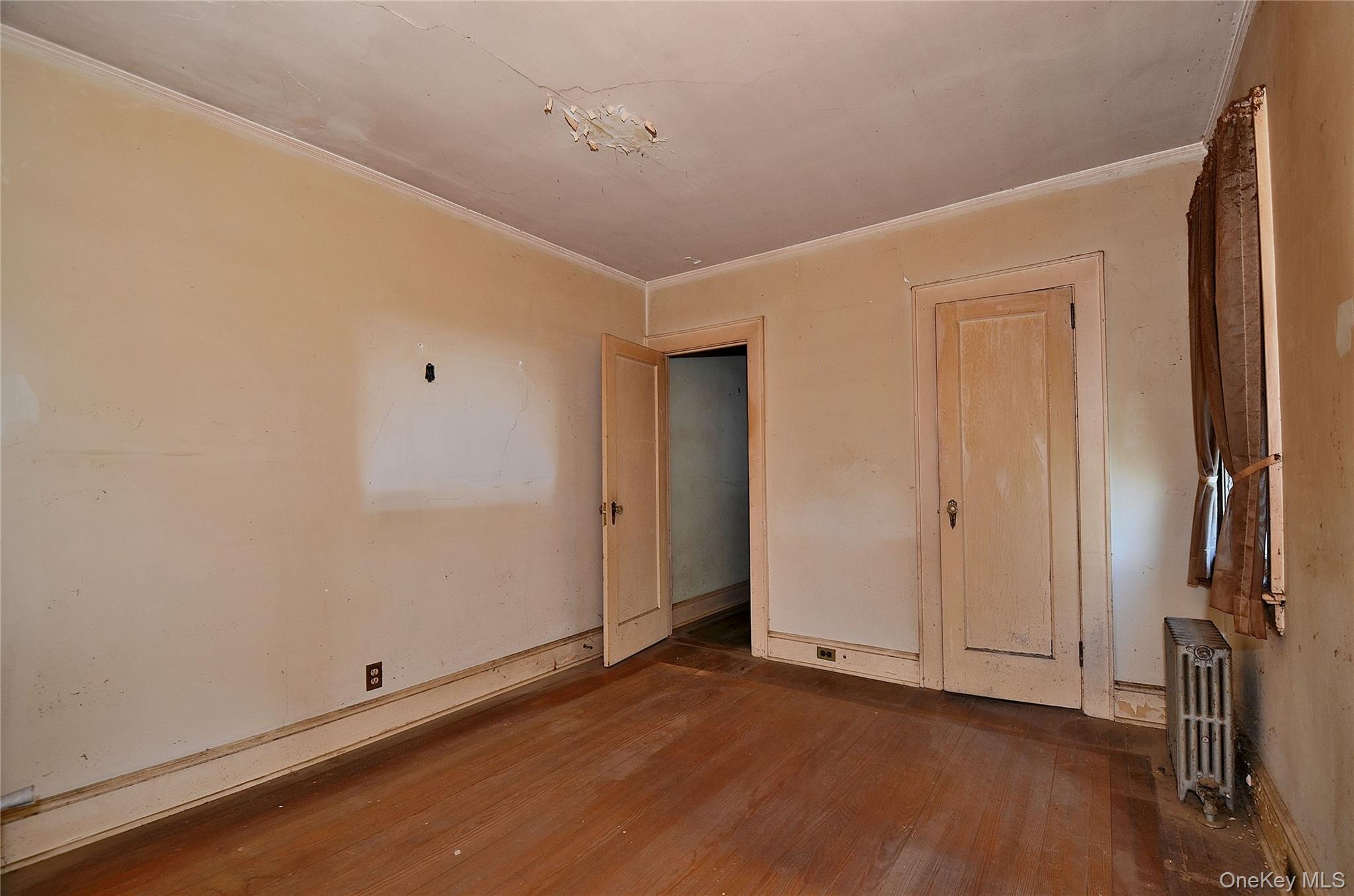 2586 Riverside Drive Wantagh, NY 11793 - Photo 15 of 28 Bedroom featuring hardwood flooring, light-toned walls, white trim