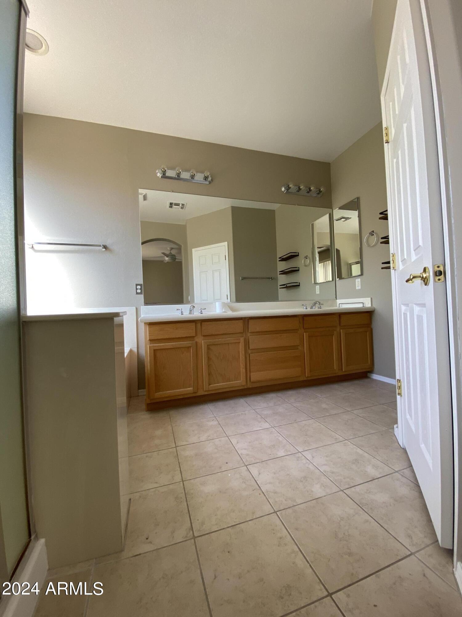 7217 West Kings Avenue Peoria, AZ 85382 - Photo 11 of 19 a view of a kitchen with an empty space and a window