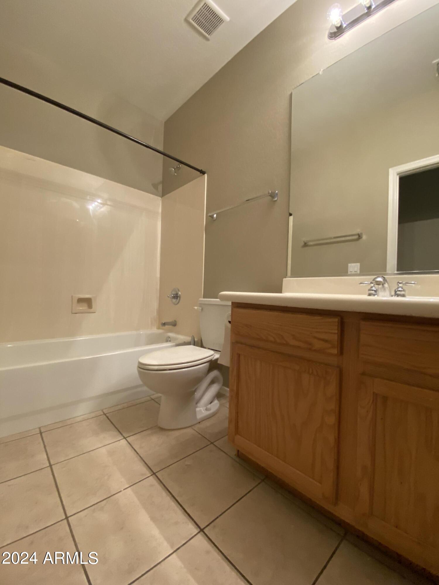 7217 West Kings Avenue Peoria, AZ 85382 - Photo 12 of 19 a bathroom with a sink a toilet and shower