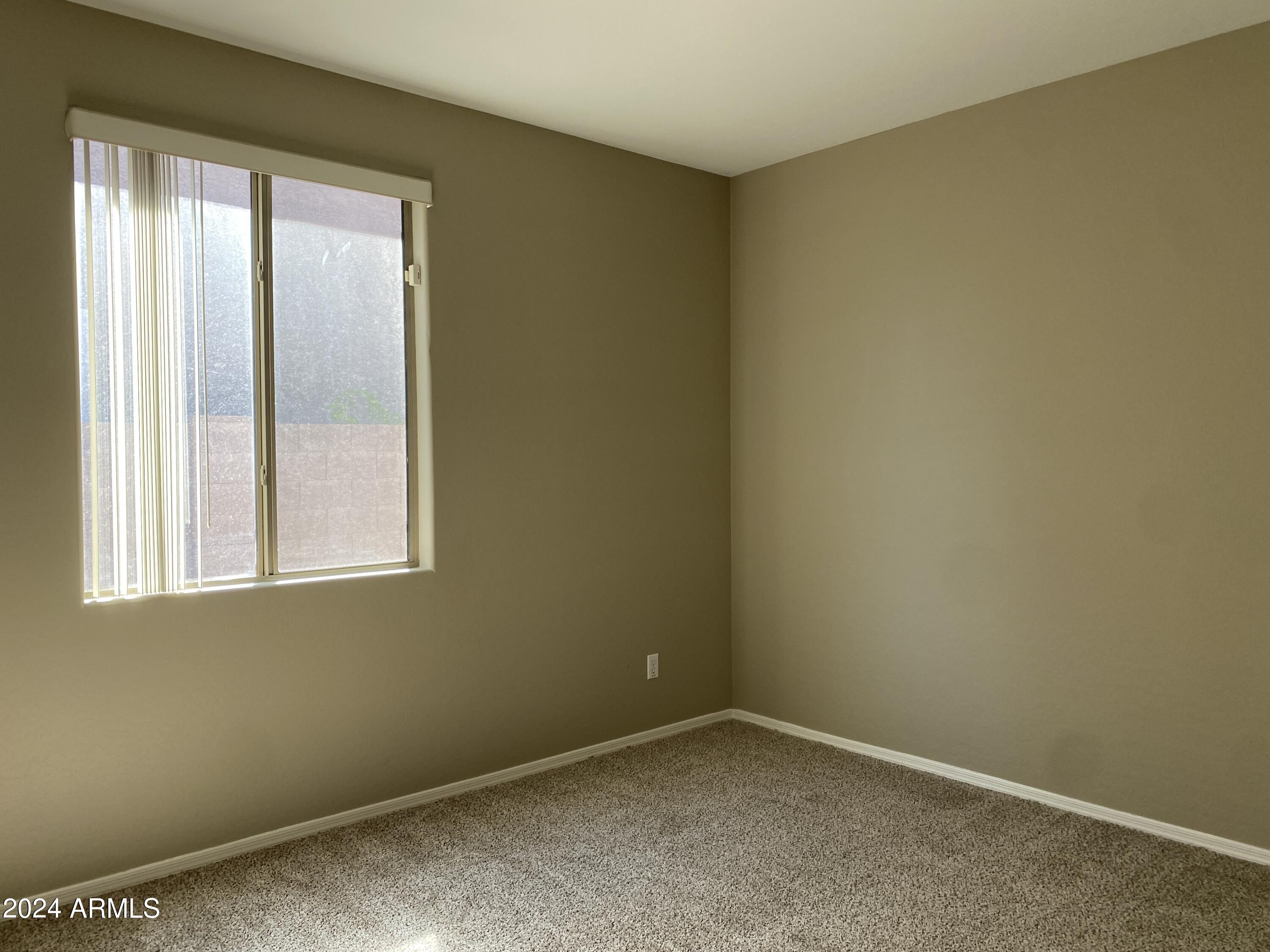 7217 West Kings Avenue Peoria, AZ 85382 - Photo 13 of 19 an empty room with a window
