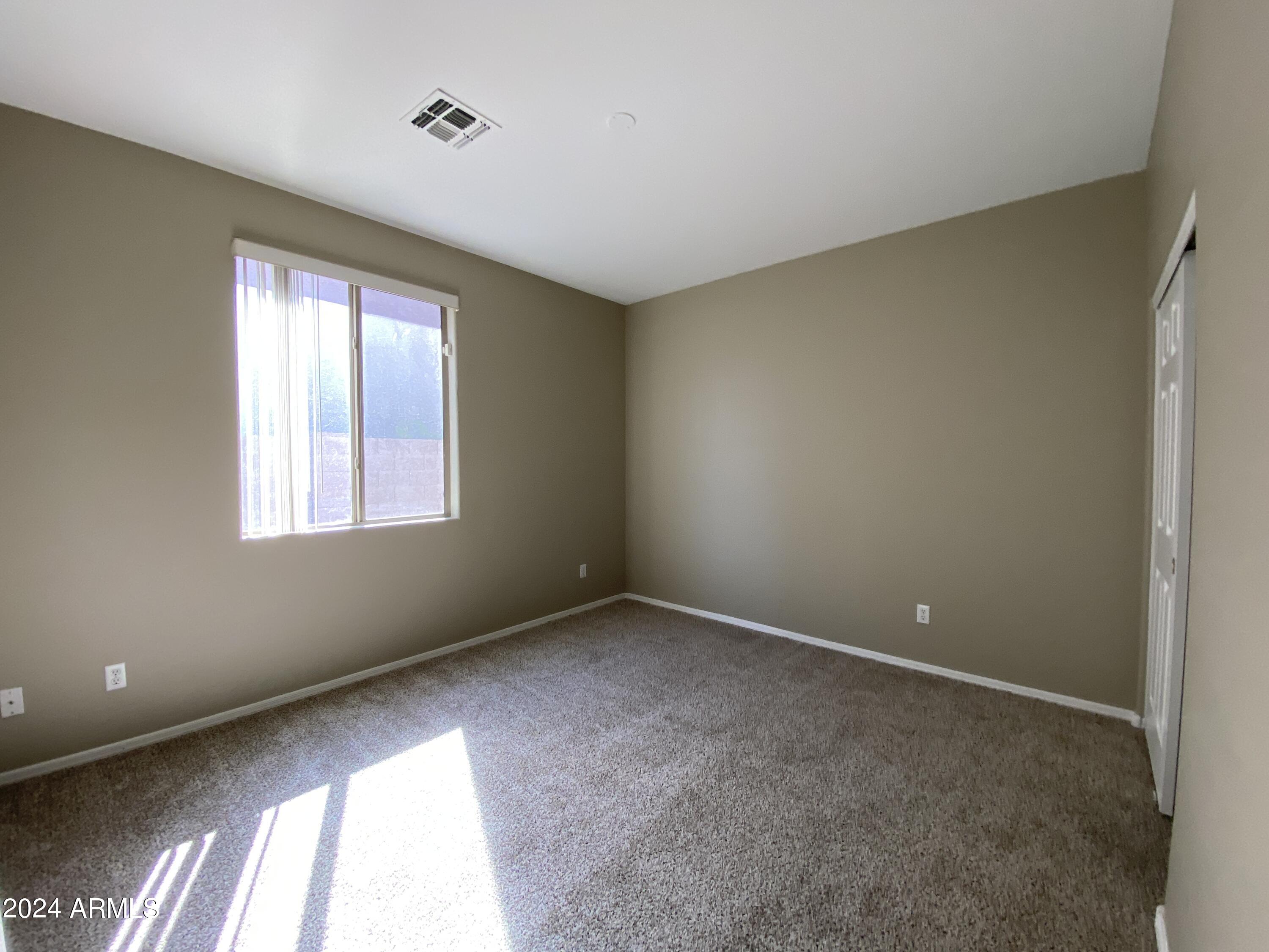 7217 West Kings Avenue Peoria, AZ 85382 - Photo 14 of 19 a view of an empty room with a window
