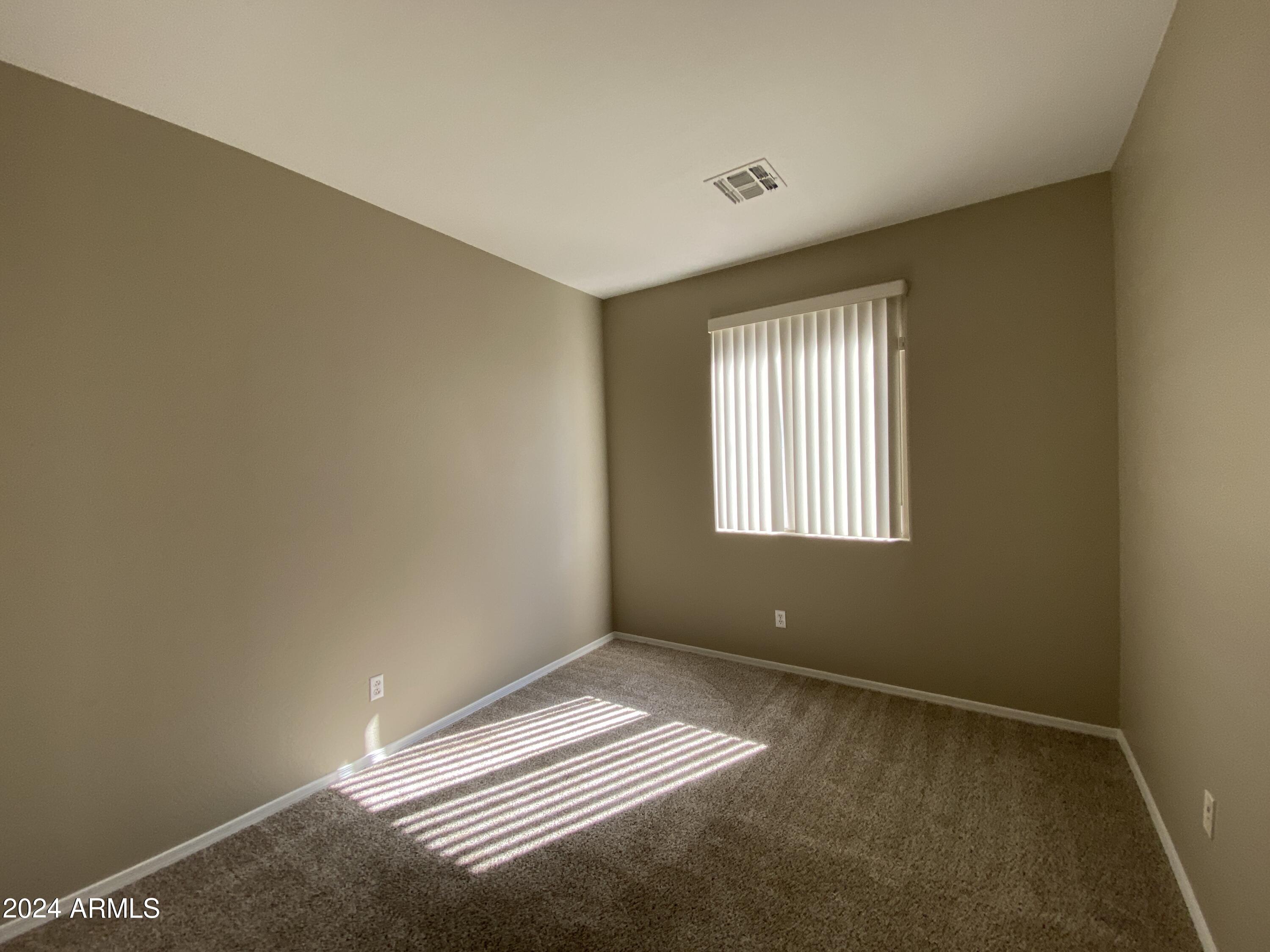7217 West Kings Avenue Peoria, AZ 85382 - Photo 17 of 19 a view of an empty room with a window