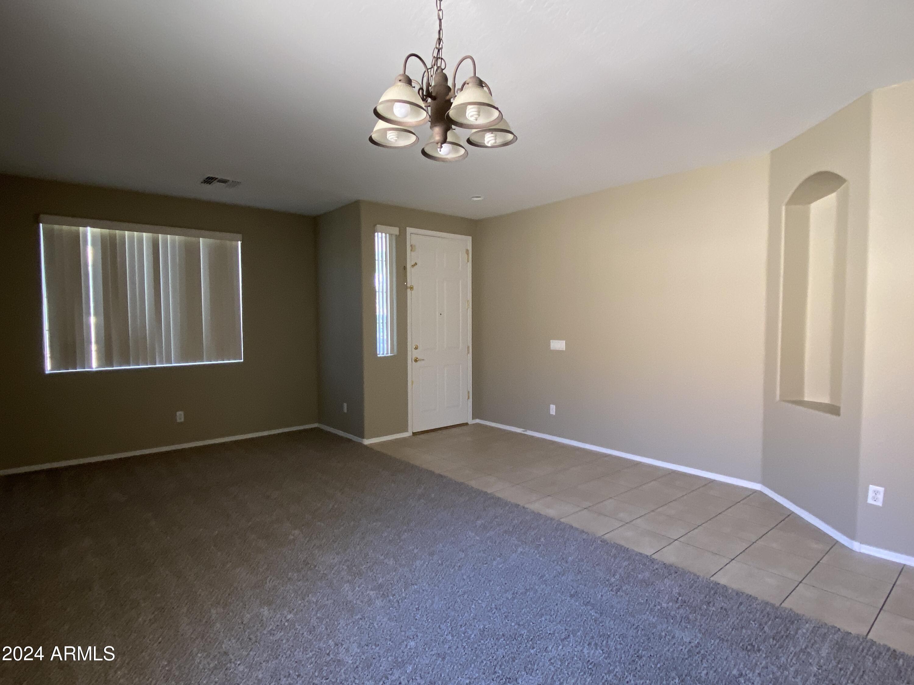 7217 West Kings Avenue Peoria, AZ 85382 - Photo 3 of 19 a view of an empty room with a window