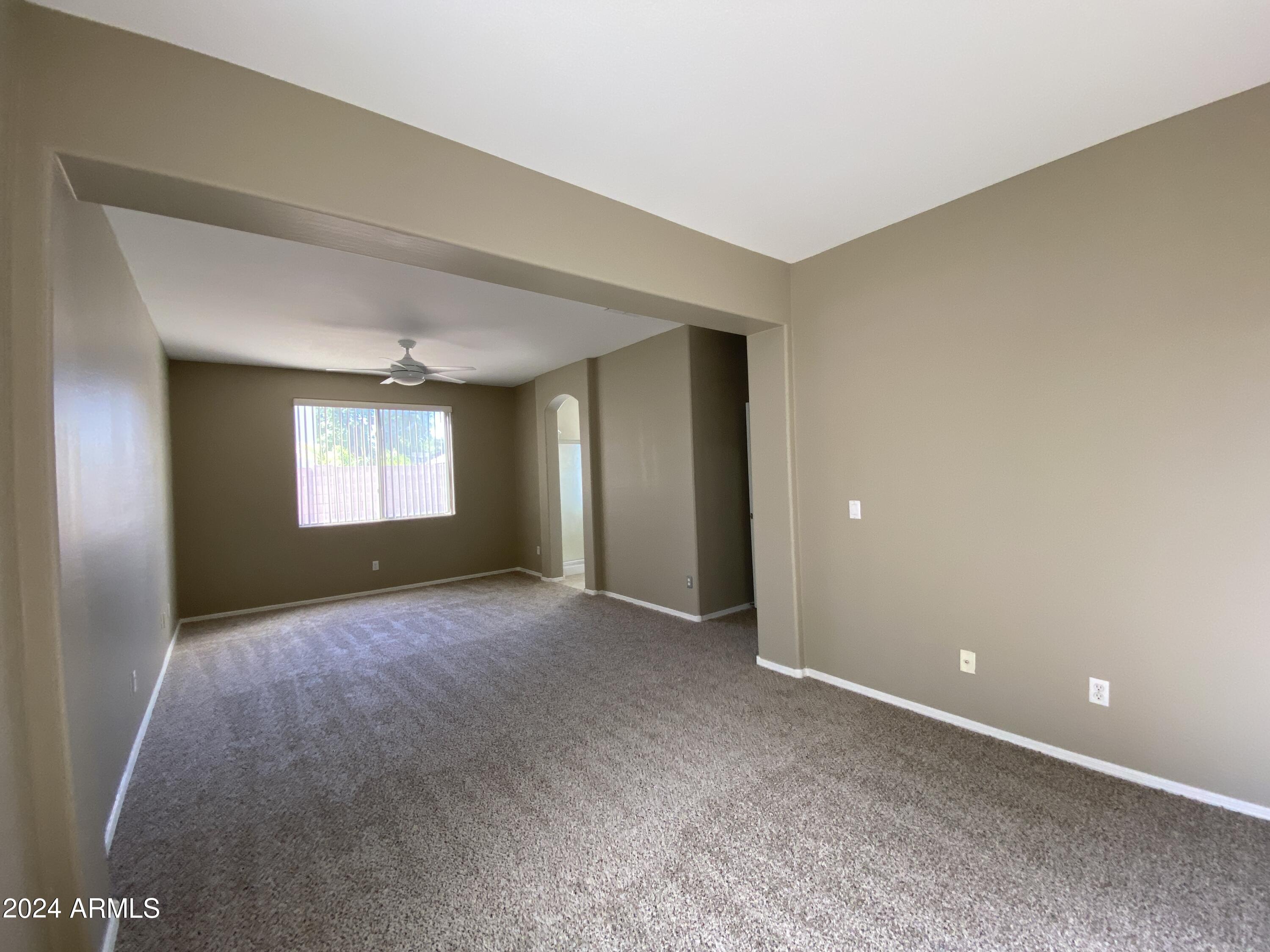 7217 West Kings Avenue Peoria, AZ 85382 - Photo 9 of 19 a view of an empty room with a window
