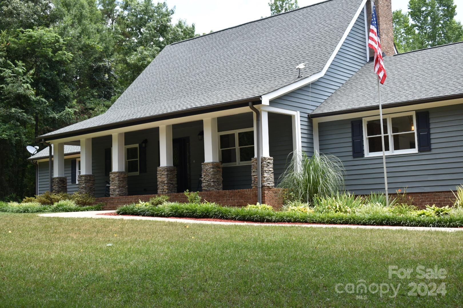 459 Patrick Road Gastonia, NC 28056 - Photo 1 of 39 a front view of a house with a yard and garage