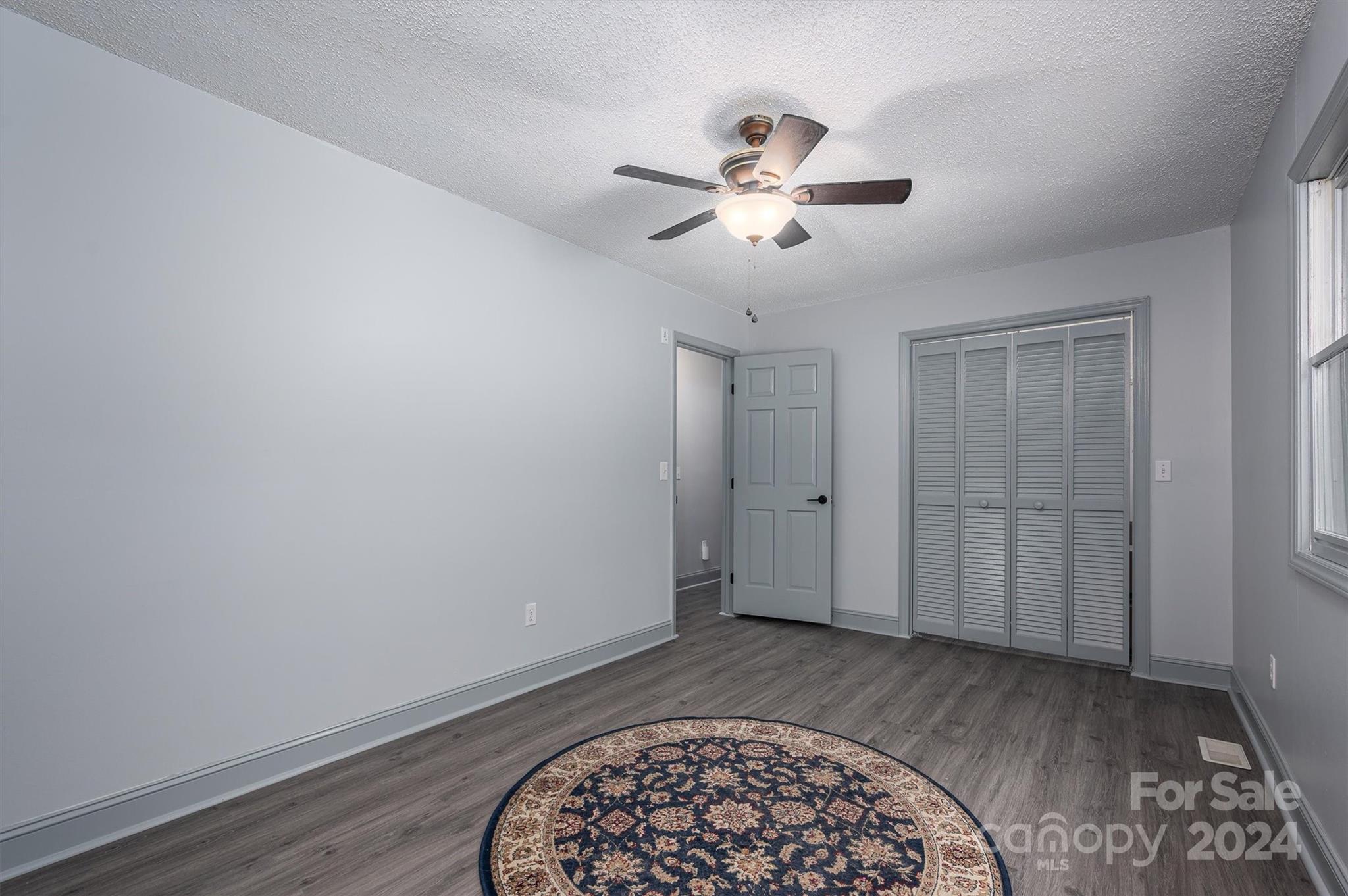 459 Patrick Road Gastonia, NC 28056 - Photo 24 of 39 a view of an empty room with a window and wooden floor